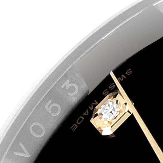 This image of the Rolex Datejust 116233 Men's Steel and Gold (two tone) Black Dial 116233 Men's Steel and Gold (two tone) Black Dial watch shows a close-up of the dial, a diamond hour marker, and part of the bezel with "SWISS MADE."