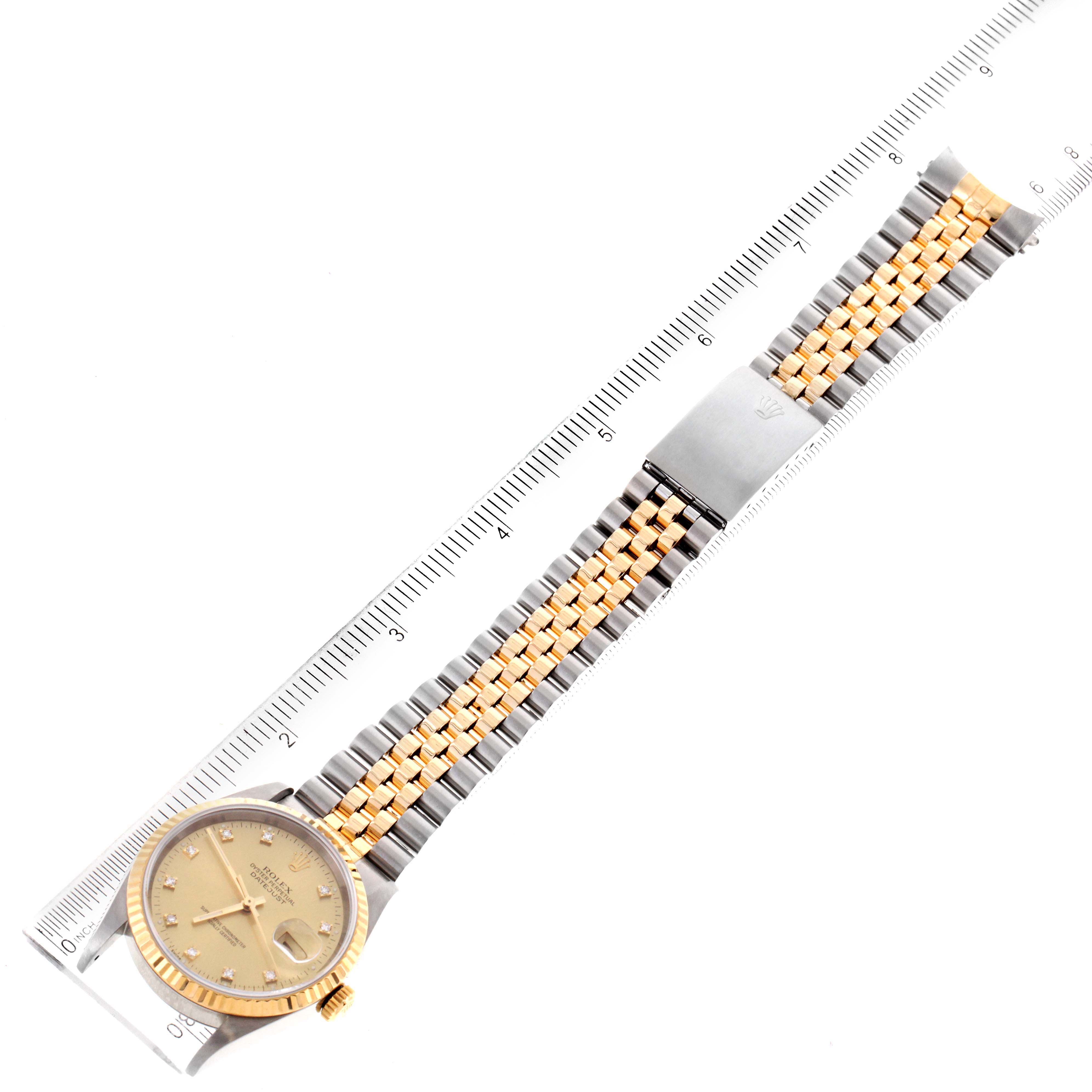 The image shows a top-down view of a Rolex Datejust 16233 Men's Steel and Gold (two tone) Champagne Dial 16233 Men's Steel and Gold (two tone) Champagne Dial watch, highlighting its gold and silver bracelet, dial, and part of the clasp.