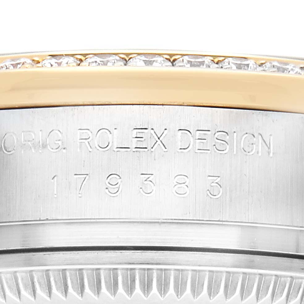 The image shows a close-up of the side of a Rolex Datejust 179383G Women's Steel and Gold (two tone) Silver Dial 179383G Women's Steel and Gold (two tone) Silver Dial, highlighting the bezel with diamonds and engraved model details.