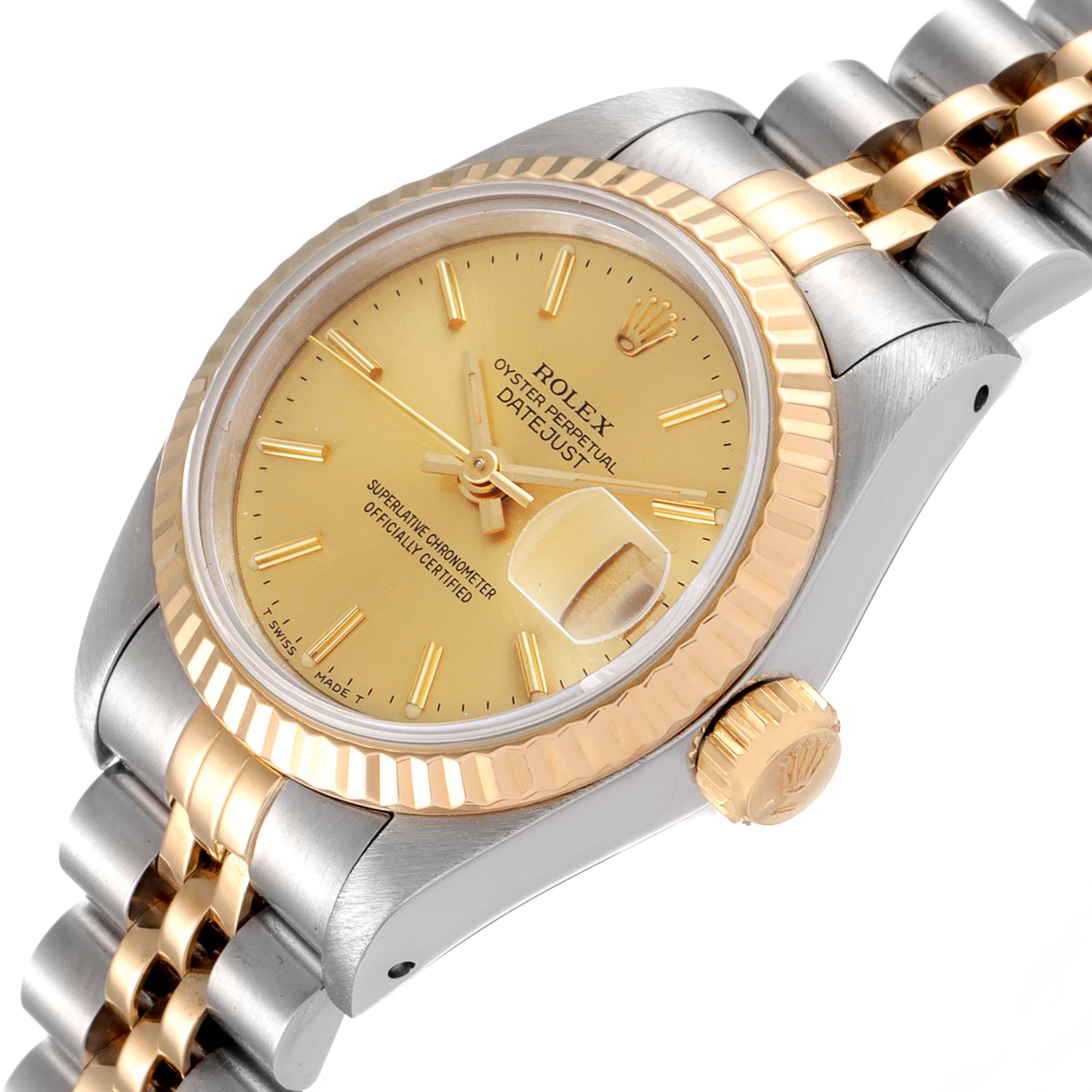 The image shows a Rolex Datejust 69173 Women
s Steel and Gold (two tone) Champagne Dial 69173 Women
s Steel and Gold (two tone) Champagne Dial watch from a tilted angle, highlighting the dial, bezel, crown, and part of the bracelet.