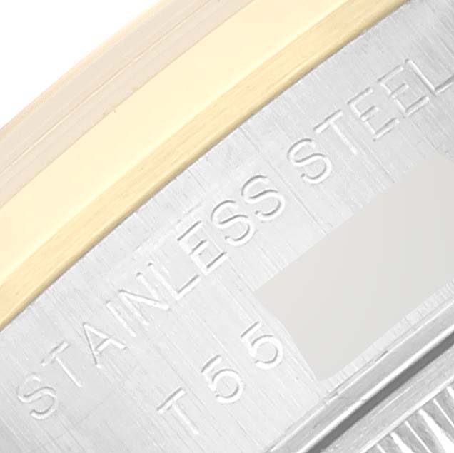 The image shows a close-up angle of the bezel and the engraved case back of a Rolex Datejust 69163 Women's Steel and Gold (two tone) Grey Dial 69163 Women's Steel and Gold (two tone) Grey Dial watch, featuring "STAINLESS STEEL."