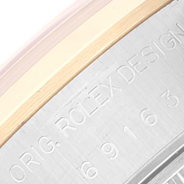 The image shows a close-up angle of the casing of a Rolex Datejust 69163 Women's Steel and Gold (two tone) Grey Dial 69163 Women's Steel and Gold (two tone) Grey Dial watch, highlighting the engraved model and brand information.