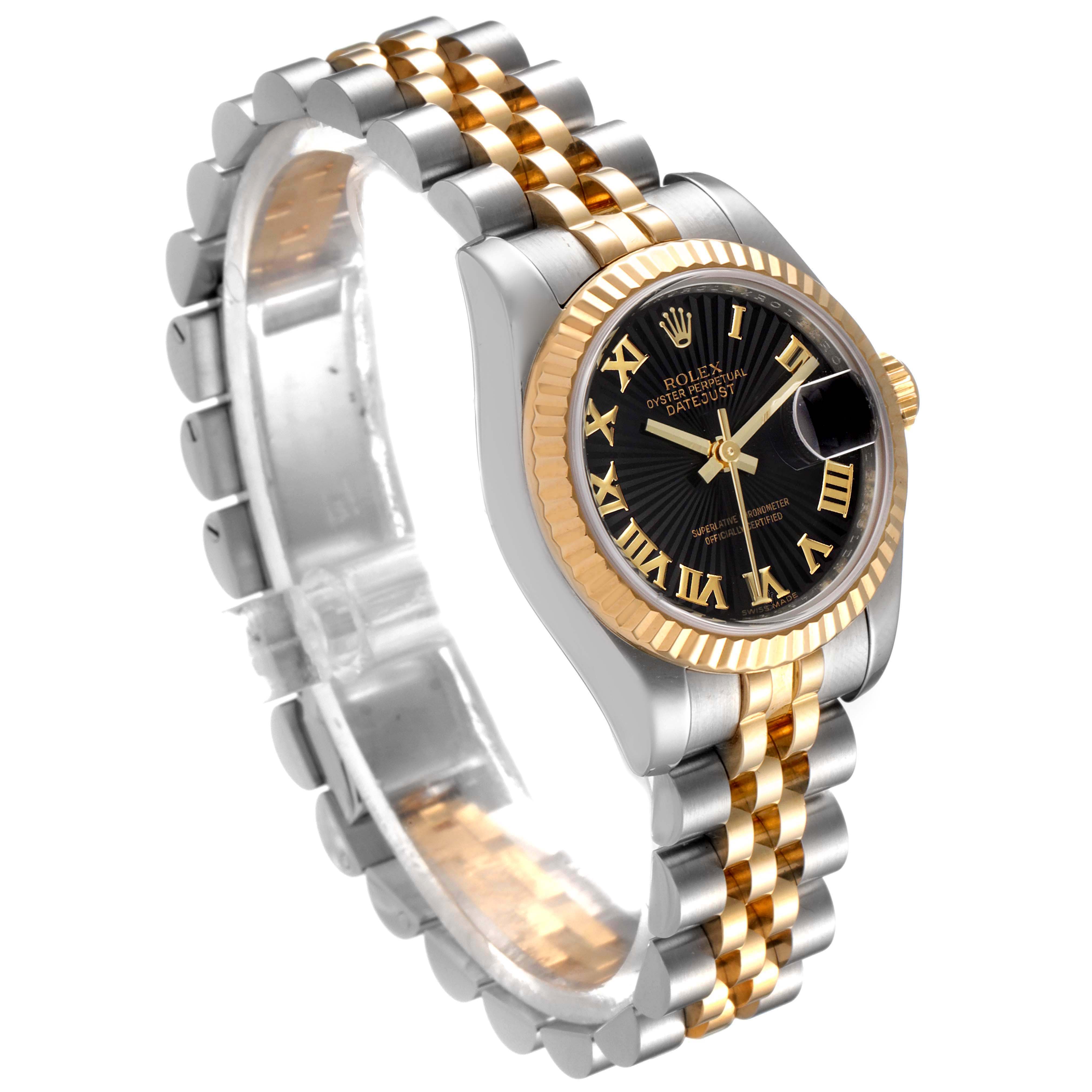 The Rolex Datejust 179173 Women
s Steel and Gold (two tone) Black Dial 179173 Women
s Steel and Gold (two tone) Black Dial watch is shown in a side angle, highlighting the dial, bezel, and Jubilee bracelet.