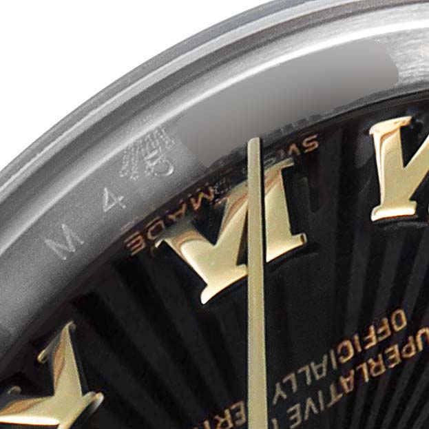 The image shows a close-up of the Rolex Datejust 179173 Women
s Steel and Gold (two tone) Black Dial 179173 Women
s Steel and Gold (two tone) Black Dial watch face, highlighting the hour markers and part of the bezel.