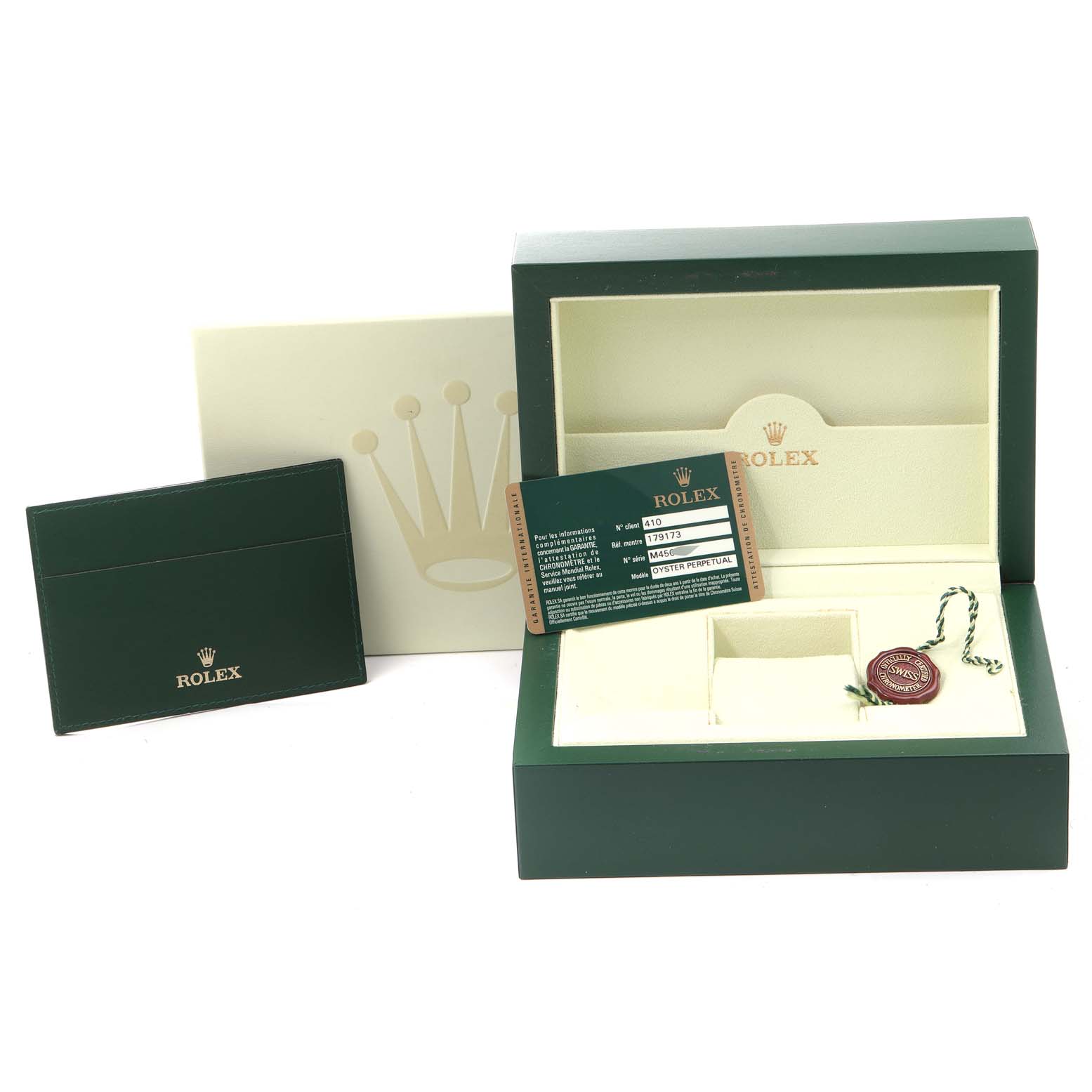 The image shows the packaging components for a Rolex Datejust 179173 Women
s Steel and Gold (two tone) Black Dial 179173 Women
s Steel and Gold (two tone) Black Dial, including the box, cardholder, certification card, and seal.