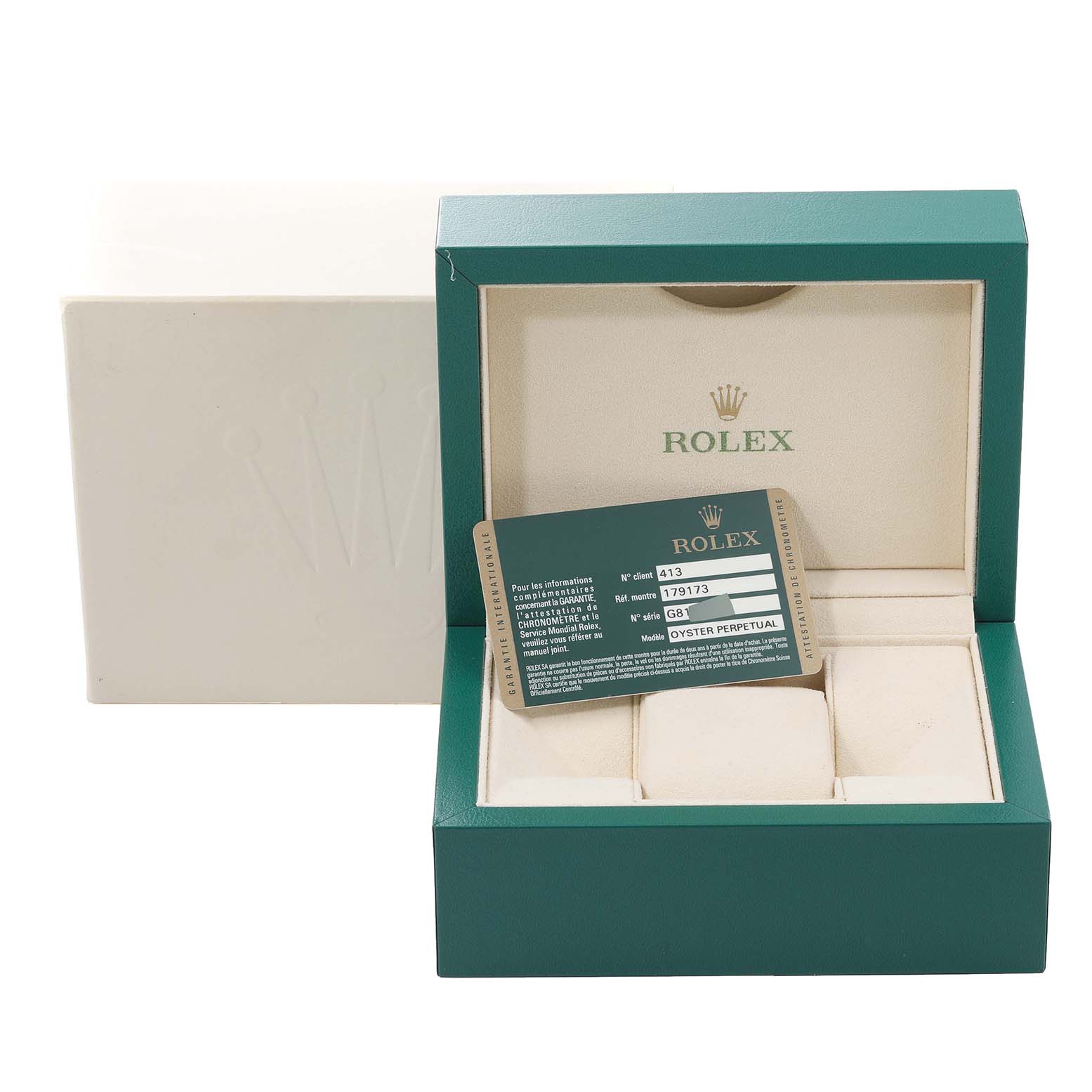 The image shows an empty Rolex Datejust 179173 Women's Steel and Gold (two tone) White Dial 179173 Women's Steel and Gold (two tone) White Dial watch box with a certification card angled inside the box.