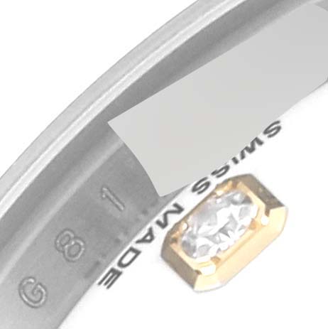 The image shows a close-up of the bezel and part of the dial with a diamond marker of a Rolex Datejust 179173 Women's Steel and Gold (two tone) White Dial 179173 Women's Steel and Gold (two tone) White Dial watch.