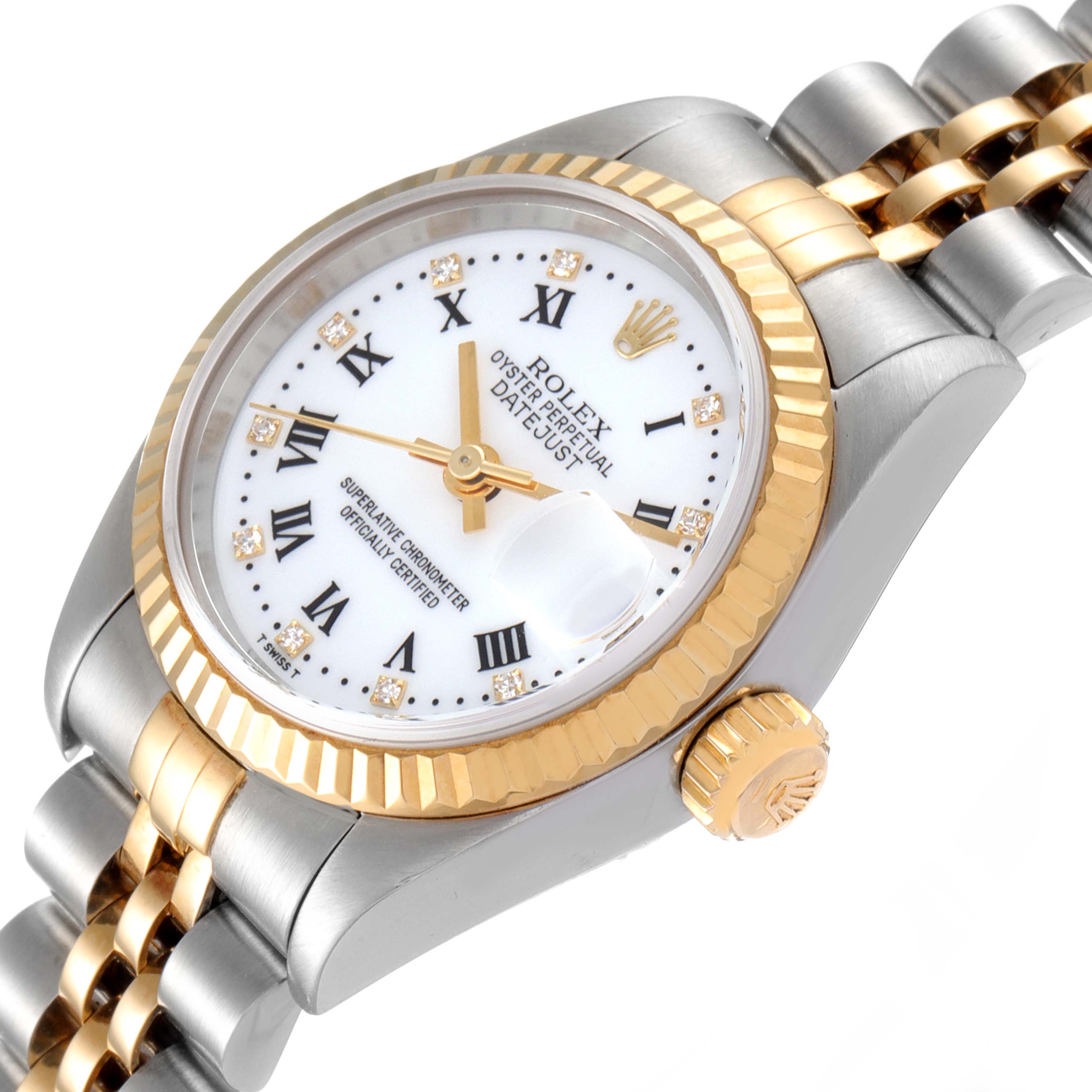 The Rolex Datejust 79173 Women
s Steel and Gold (two tone) White Dial 79173 Women
s Steel and Gold (two tone) White Dial watch is shown at an angled close-up, displaying its dial, bezel, crown, and part of the bracelet.