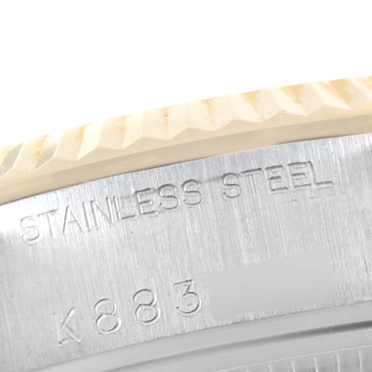 This close-up image shows the side of the stainless steel case of a Rolex Datejust 79173 Women
s Steel and Gold (two tone) White Dial 79173 Women
s Steel and Gold (two tone) White Dial watch.