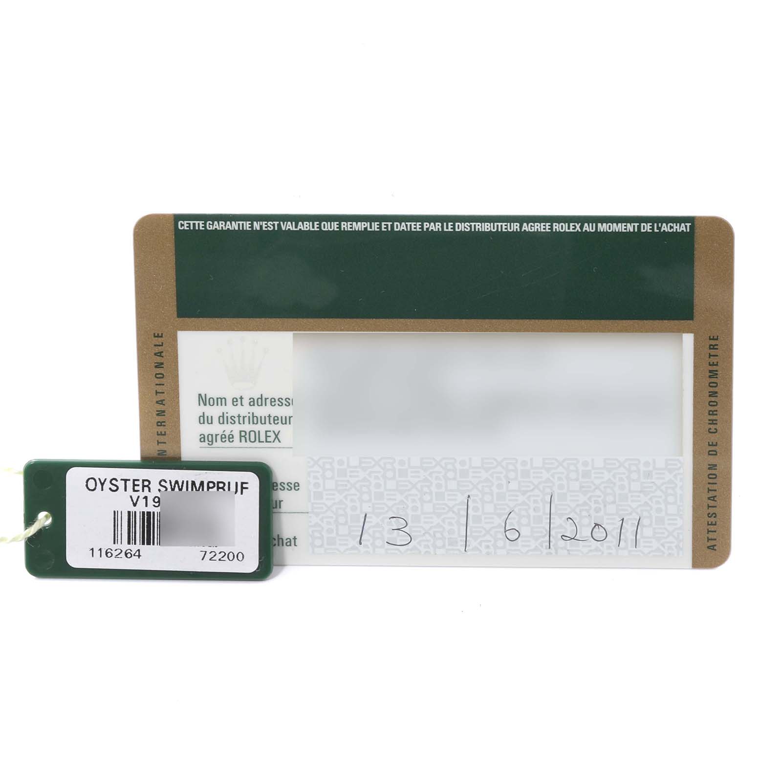 The image shows a warranty card and an Oyster Swimpruf tag associated with a Rolex Turn-o-Graph 116264 Men's Stainless Steel Black Dial 116264 Men's Stainless Steel Black Dial watch.