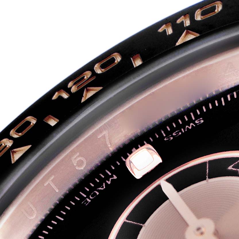 The image shows a close-up of the bezel and edge of the dial of a Rolex Daytona 116515LN Men's Rose Gold Black Dial 116515LN Men's Rose Gold Black Dial, highlighting the tachymetric scale.