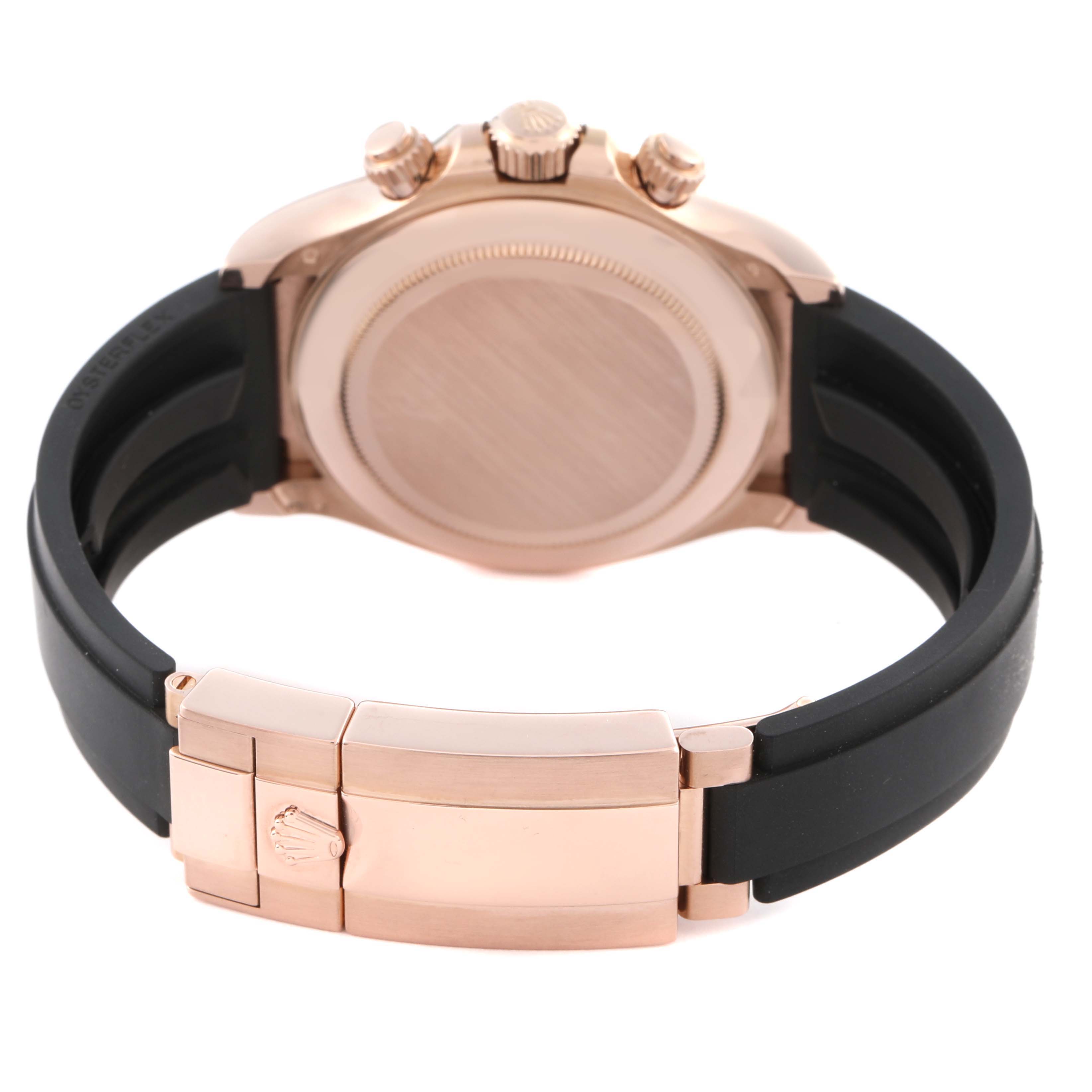 The image shows the back view of a Rolex Daytona 116515LN Men's Rose Gold Black Dial 116515LN Men's Rose Gold Black Dial, highlighting the case, crown, buttons, and bracelet clasp.