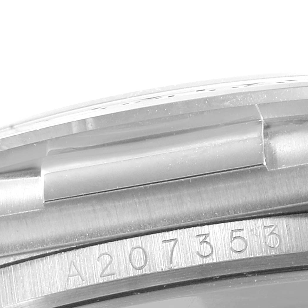 This image shows a close-up of the serial number and the side of the case for a Rolex Daytona 16519 Men's White Gold Mother of Pearl Dial 16519 Men's White Gold Mother of Pearl Dial watch.