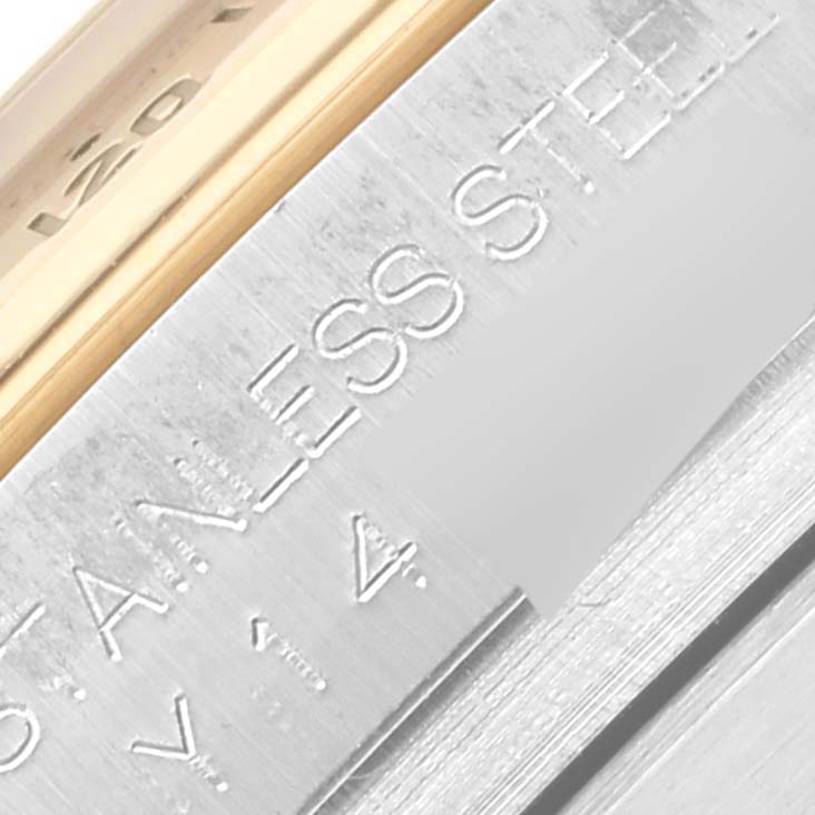 The image shows a close-up of the side of a Rolex Daytona 116523NR Men
s Steel and Gold (two tone) Mother of Pearl Dial 116523NR Men
s Steel and Gold (two tone) Mother of Pearl Dial, highlighting the metal finish and "STAINLESS STEEL" engraving.