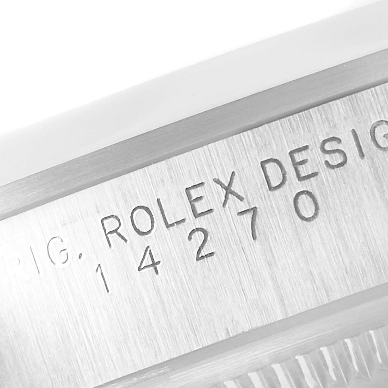The image shows a close-up angle of the serial number engraving on the side of a Rolex Explorer 14270 Men's Stainless Steel Black Dial 14270 Men's Stainless Steel Black Dial model watch.