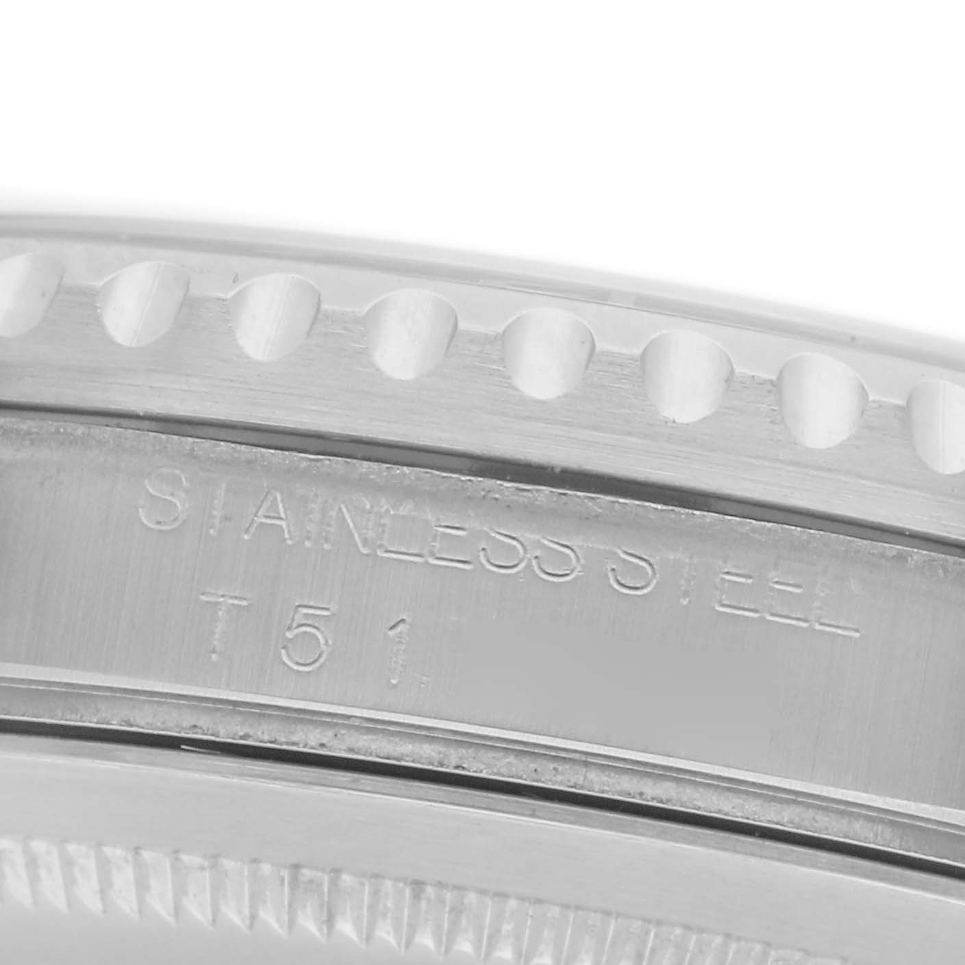 The image shows the side engraving on a Rolex GMT-Master 16700 Men's Stainless Steel Black Dial 16700 Men's Stainless Steel Black Dial watch, focusing on the stainless steel inscription and part of the bezel.