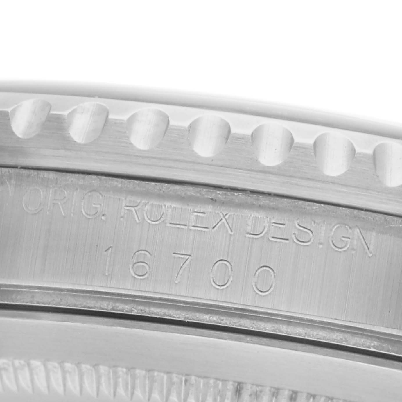 The image shows a close-up of the side engraving on the case of a Rolex GMT-Master 16700 Men's Stainless Steel Black Dial 16700 Men's Stainless Steel Black Dial, displaying the model number 16700.
