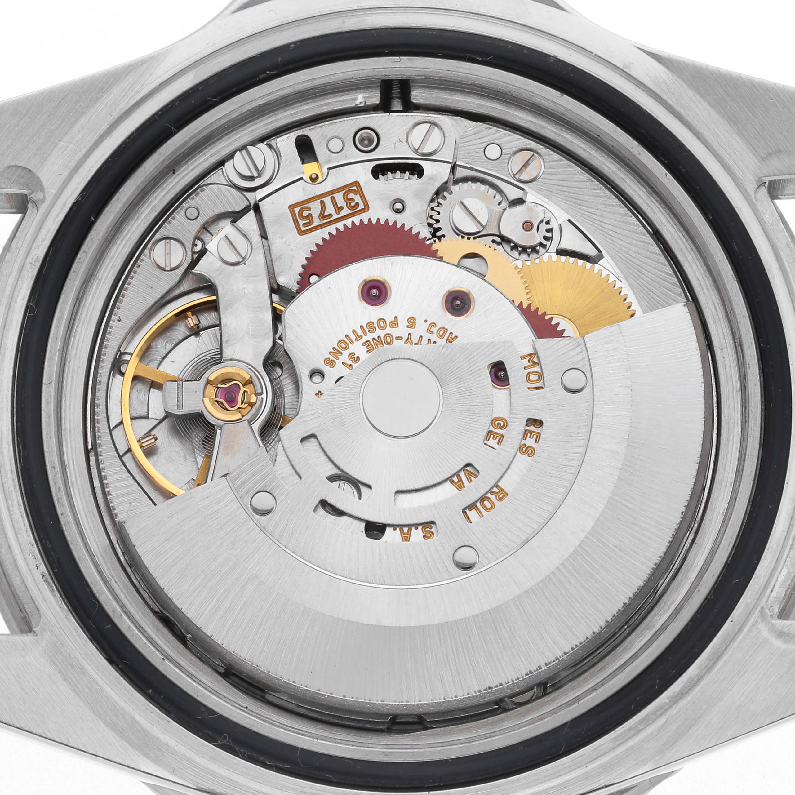 The image shows the movement of a Rolex GMT-Master 16700 Men's Stainless Steel Black Dial 16700 Men's Stainless Steel Black Dial watch, highlighting gears and internal mechanisms from a top-down angle.