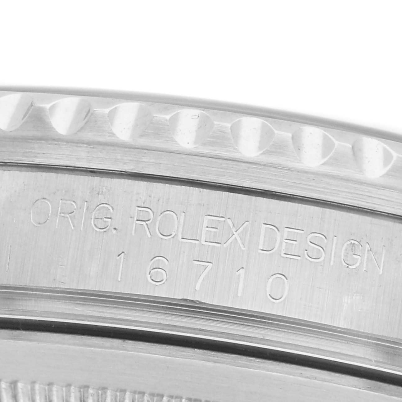 The image shows a close-up of the side engraving on the Rolex GMT-Master 16710 Men's Stainless Steel Black Dial 16710 Men's Stainless Steel Black Dial model, displaying the design number "16710."