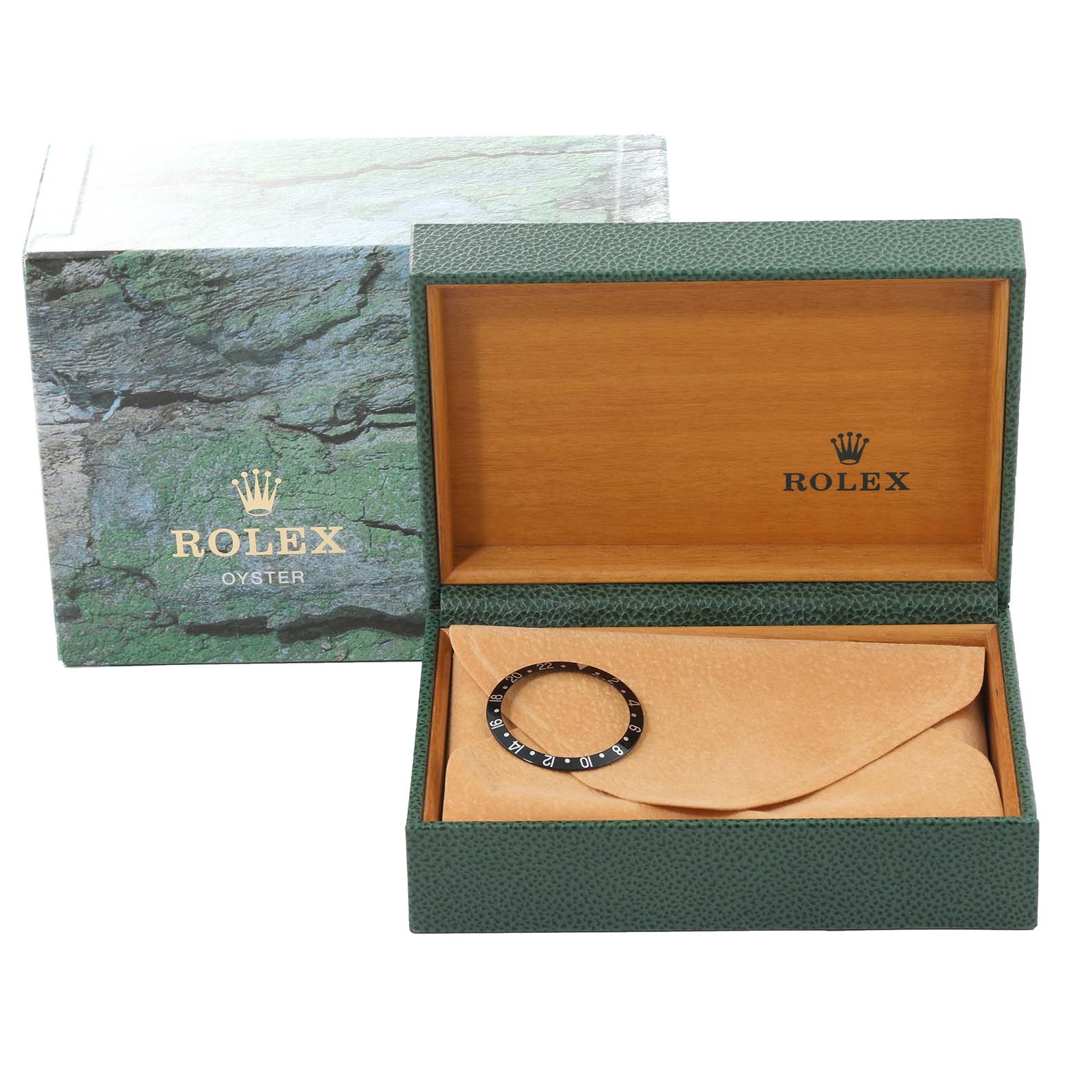 A GMT-Master Rolex bezel is shown inside its open green and wooden Rolex box, alongside the outer packaging.