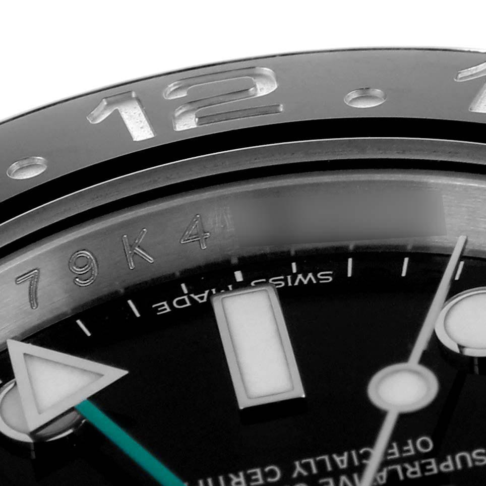 The image shows a close-up of the bezel, dial, and hands of a Rolex GMT-Master 116710 Men's Stainless Steel Black Dial 116710 Men's Stainless Steel Black Dial.
