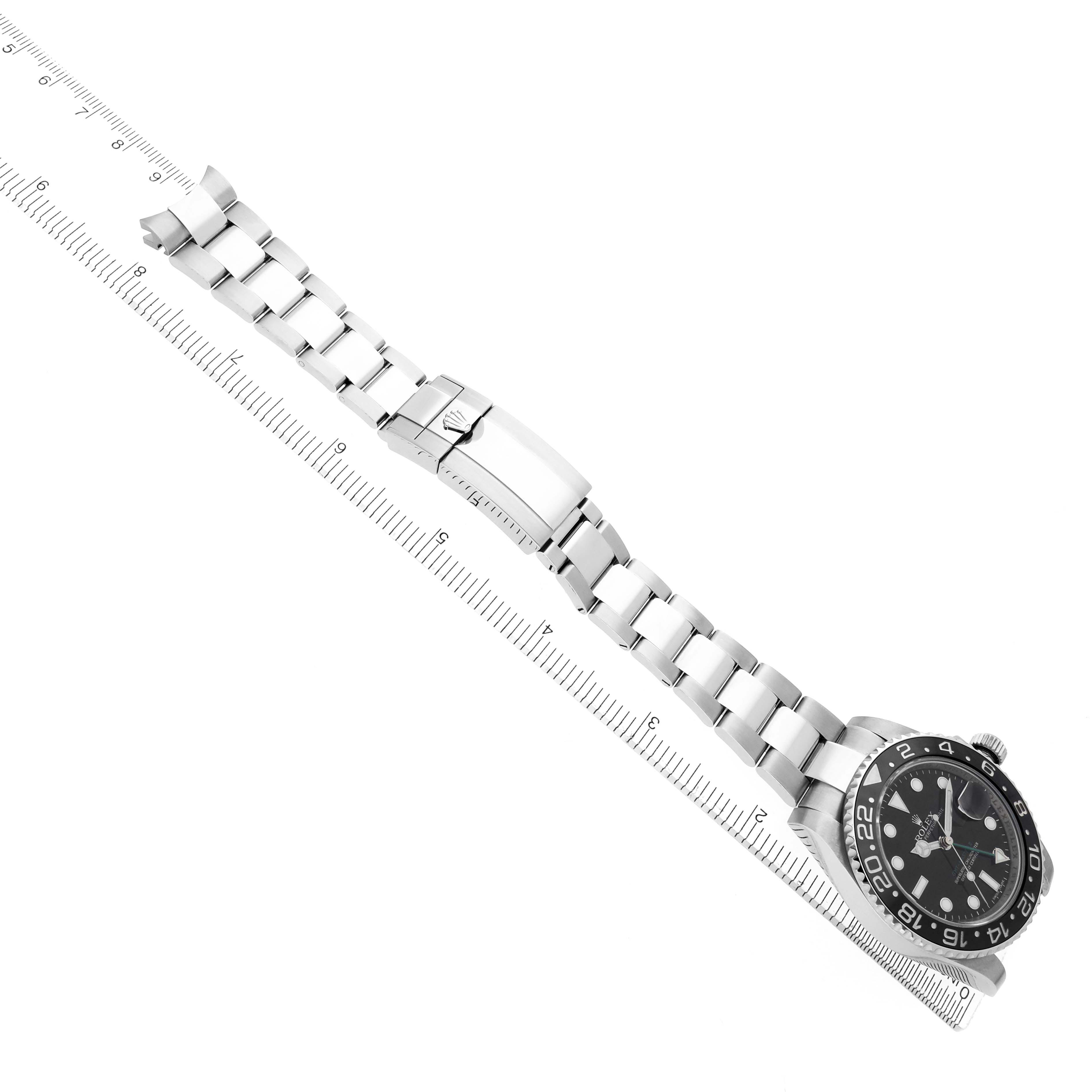 The Rolex GMT-Master 116710 Men's Stainless Steel Black Dial 116710 Men's Stainless Steel Black Dial watch is displayed diagonally, showcasing its bracelet, clasp, and partially the dial and bezel.
