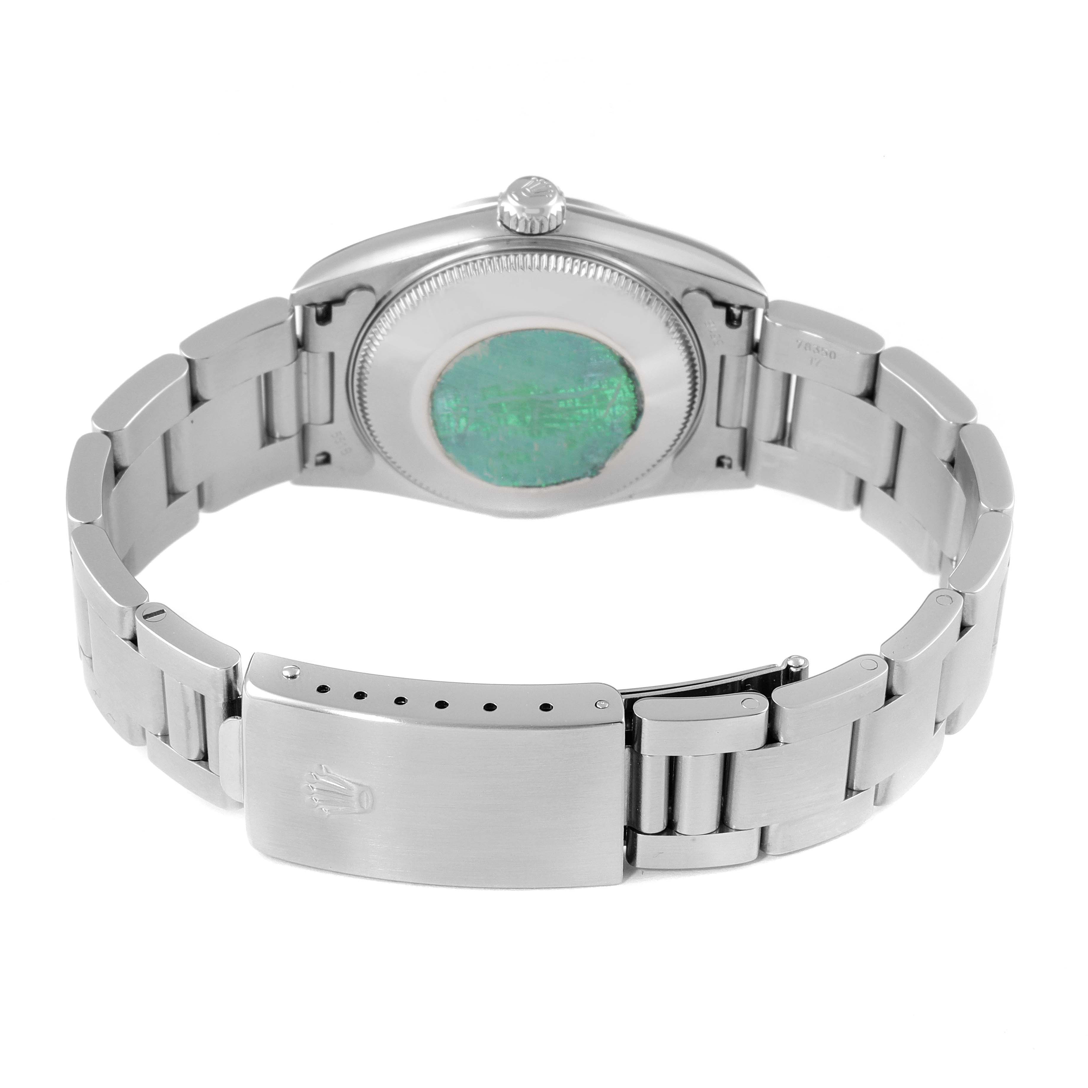 This image shows the back side and bracelet of a Mid-Size Rolex watch, emphasizing the case back and clasp.