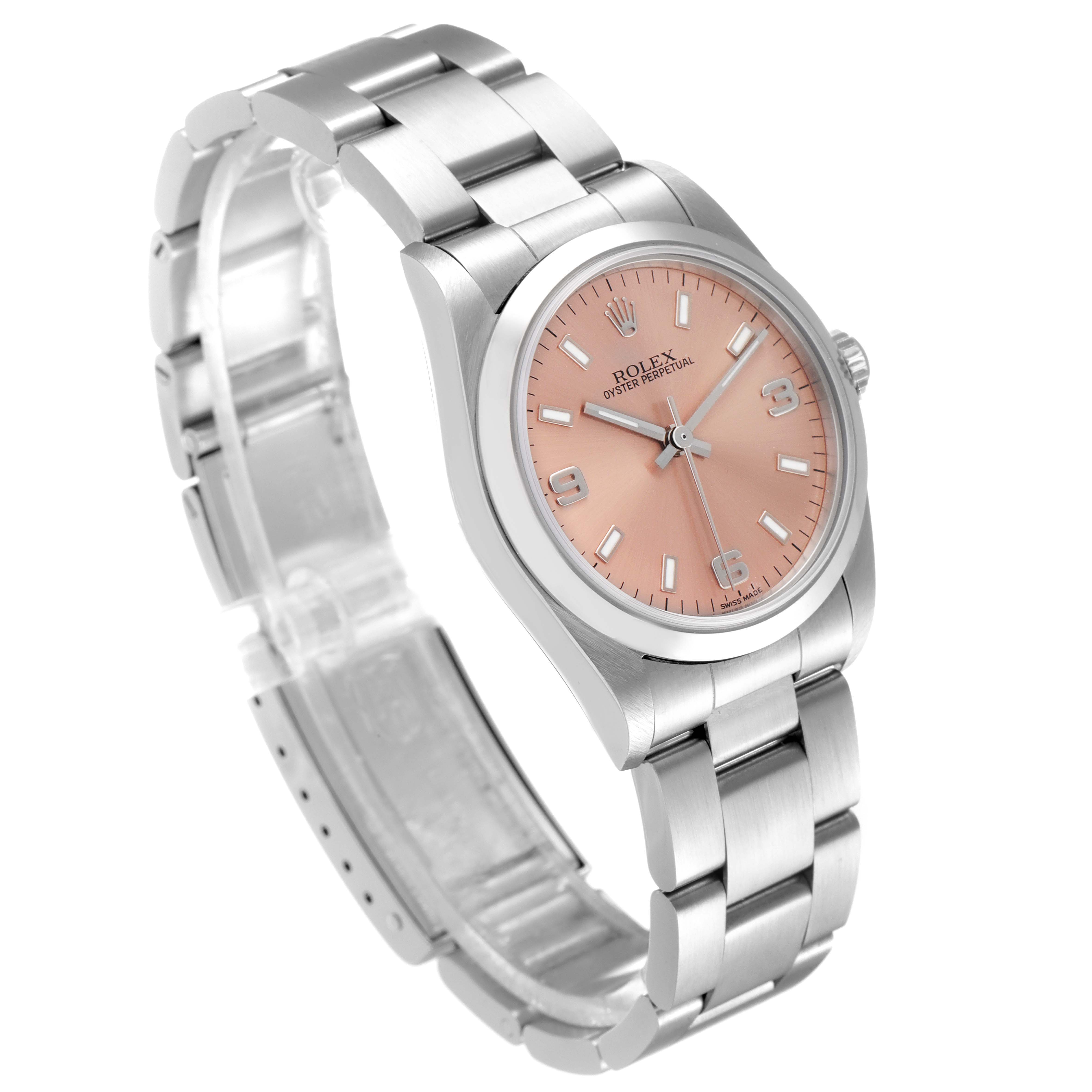 The Rolex Mid-Size 77080 Women
s Stainless Steel Pink Dial 77080 Women
s Stainless Steel Pink Dial Oyster Perpetual watch is shown in a three-quarter view, displaying the dial, case, and bracelet.