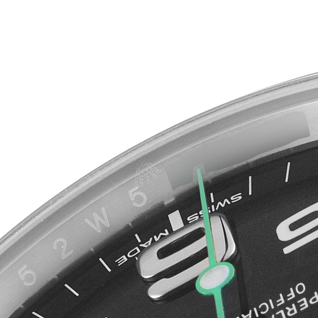 This image shows a close-up angle of the Rolex Air-King 116900 Men's Stainless Steel Black Dial 116900 Men's Stainless Steel Black Dial watch, highlighting the 9 o'clock hour marker and the second hand.