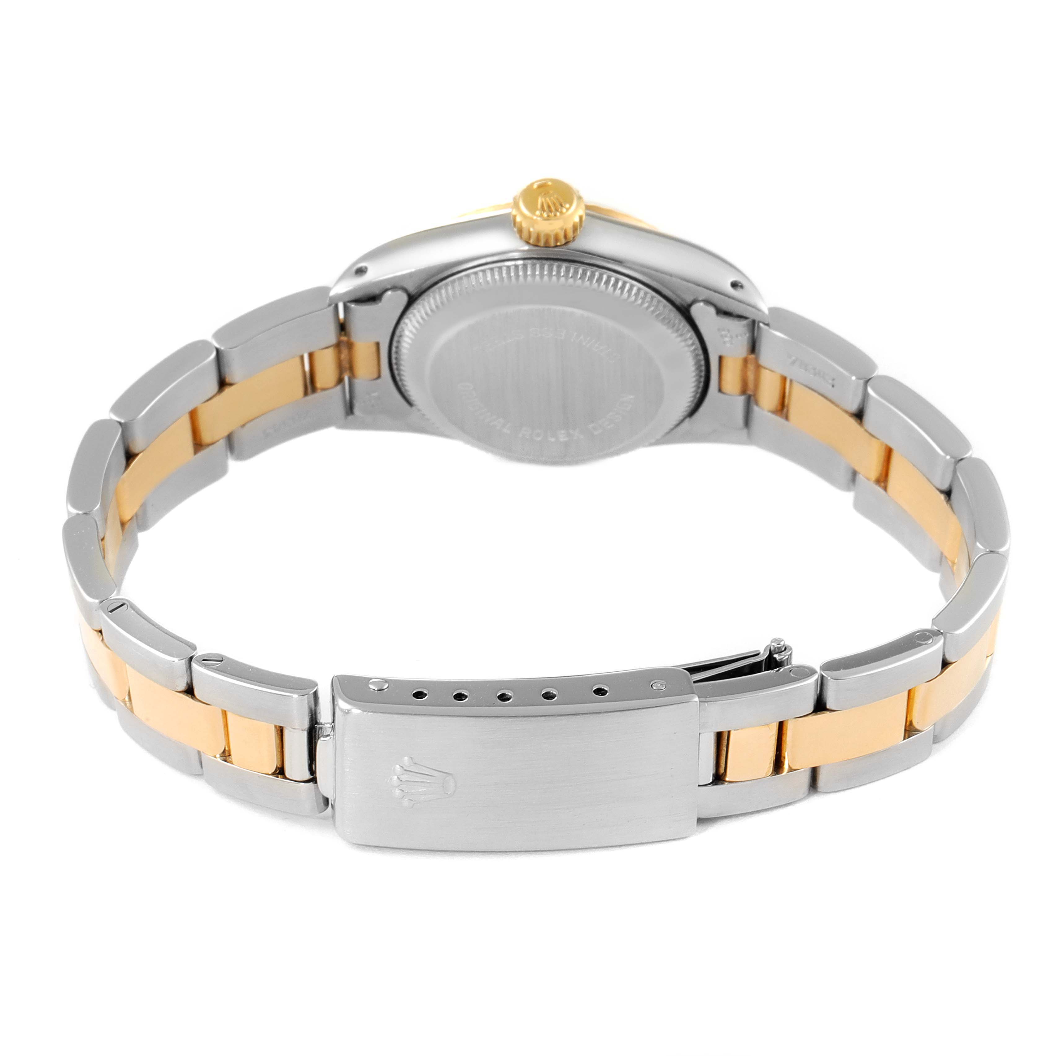 The image shows the back angle of a Rolex Oyster Perpetual 67193 Women
s Steel and Gold (two tone) Champagne Dial 67193 Women
s Steel and Gold (two tone) Champagne Dial watch, highlighting its case, gold crown, and two-tone bracelet with clasp.