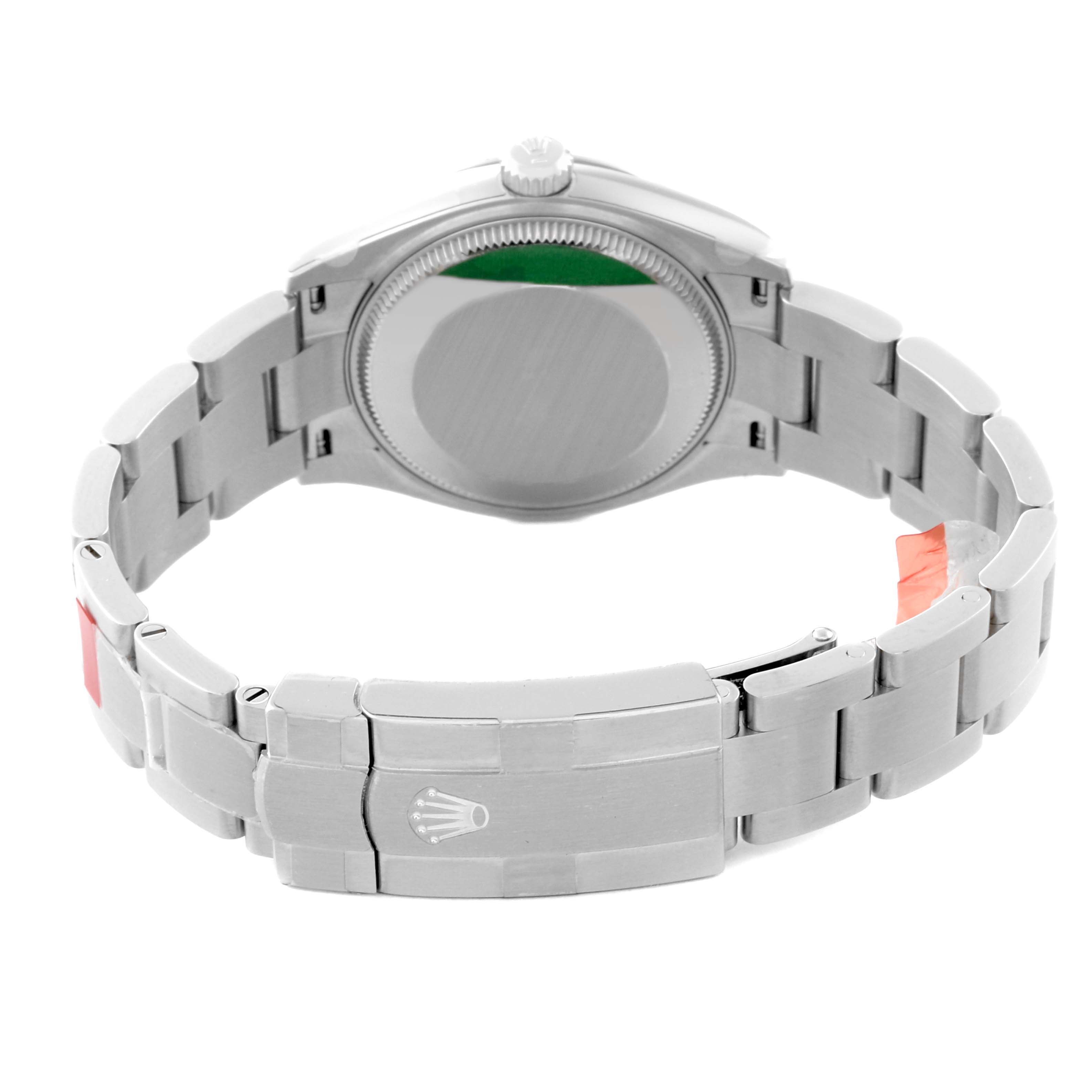 The image shows the back view of a Mid-Size Rolex watch, highlighting the case back and the closed clasp bracelet.