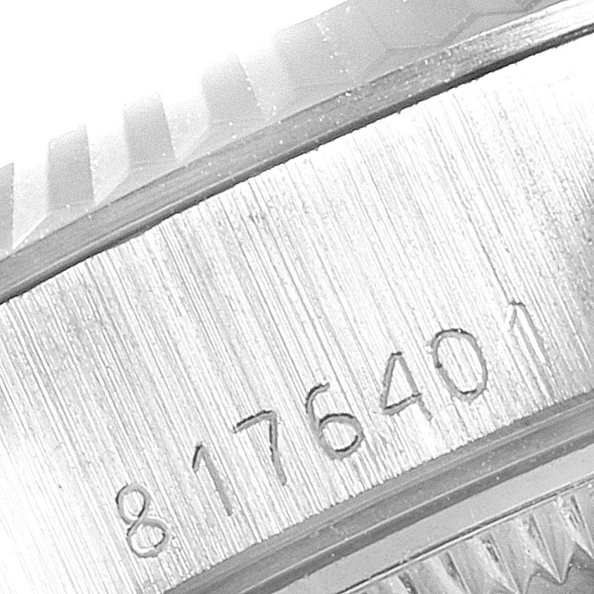 This is a close-up view of the serial number on the side of the Rolex President 69179 Women
s White Gold Silver Dial 69179 Women
s White Gold Silver Dial model watch case.