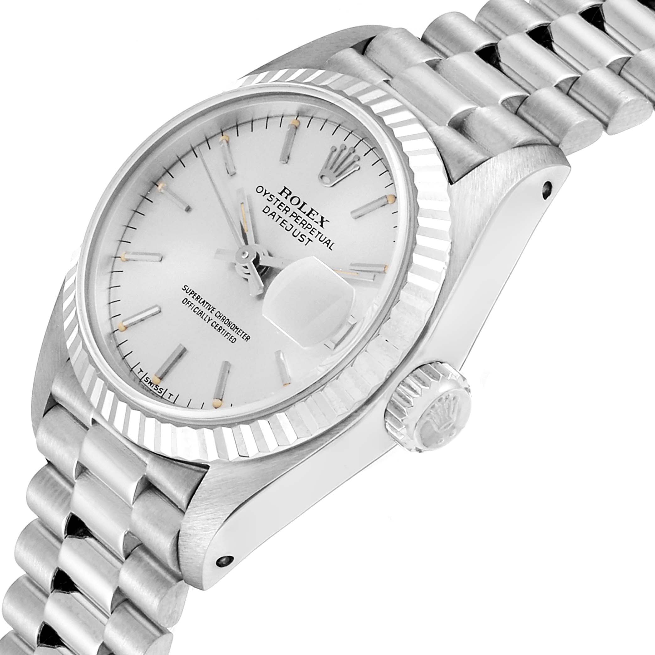This image shows a Rolex President 69179 Women
s White Gold Silver Dial 69179 Women
s White Gold Silver Dial model watch from a side angle, highlighting the face, crown, and bracelet.