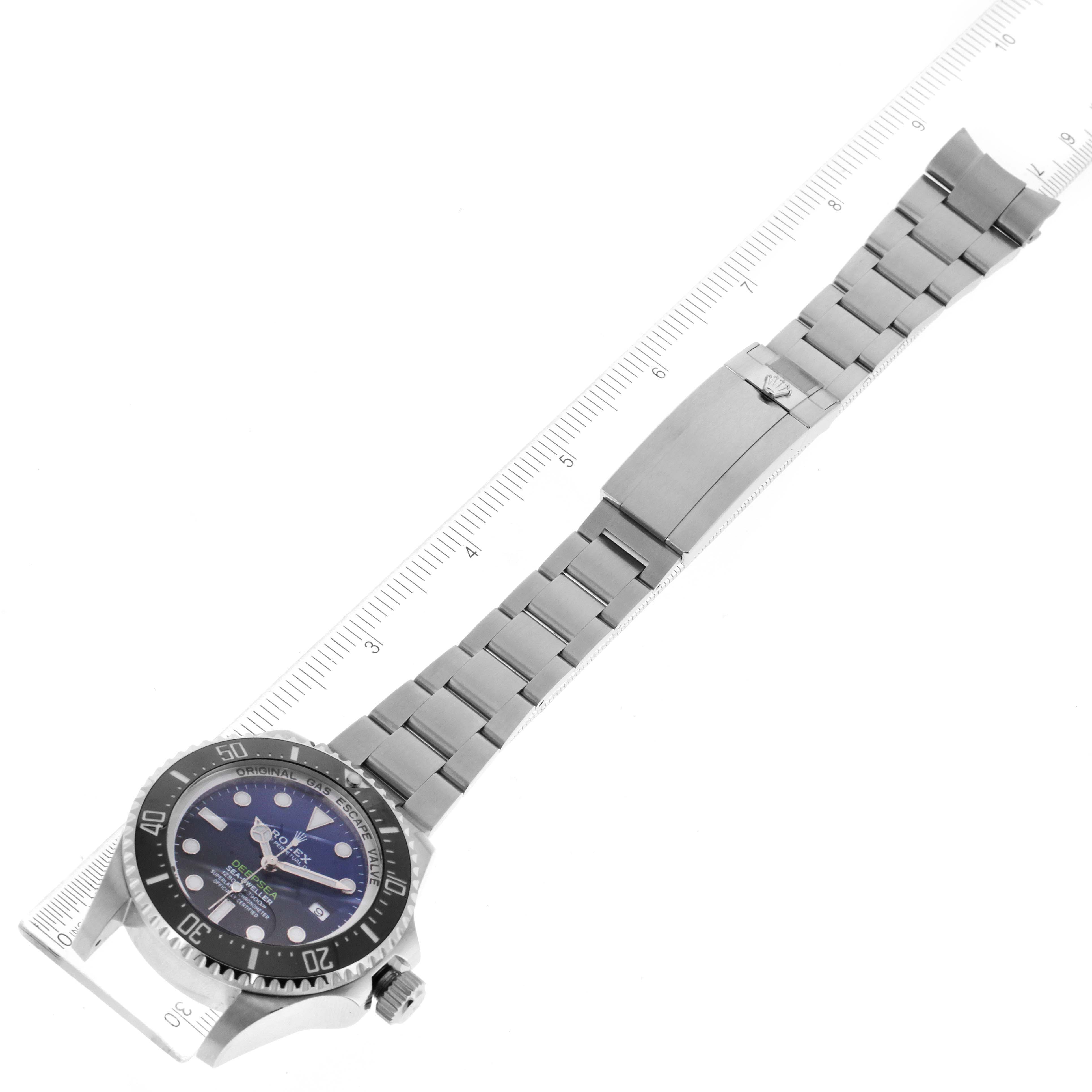This image shows a top-down view of the Rolex Sea-Dweller 116660 Men
s Stainless Steel Blue Dial 116660 Men
s Stainless Steel Blue Dial watch, displaying its face, bezel, crown, and bracelet with a ruler for scale.