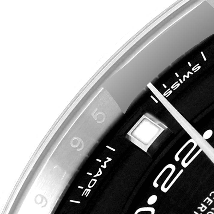 The image shows a close-up of the Rolex Sky-Dweller 326934 Men
s Stainless Steel Black Dial 326934 Men
s Stainless Steel Black Dial watch, focusing on the dial, bezel, and part of the minute hand.