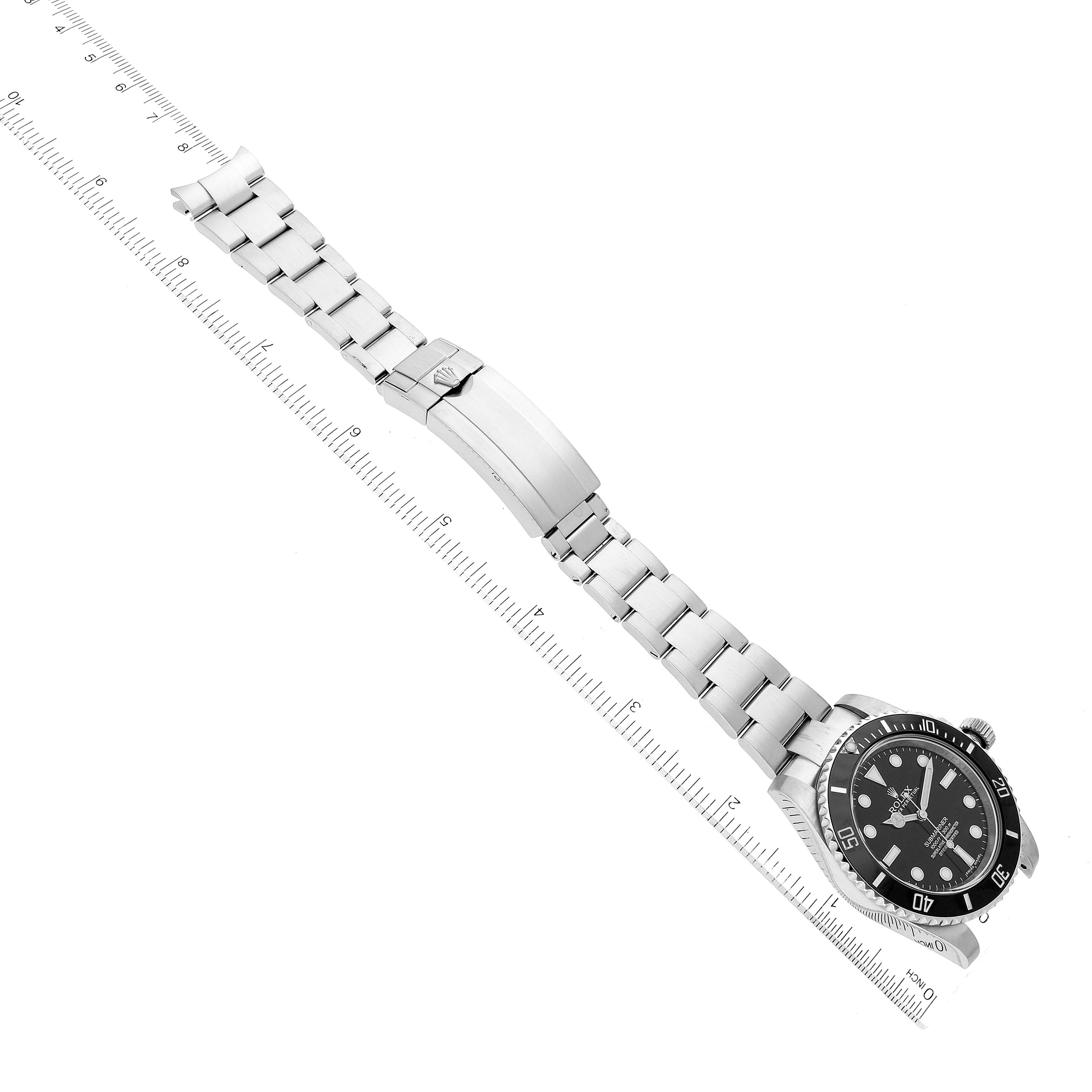 The image shows a Rolex Submariner 114060 Men
s Stainless Steel Black Dial 114060 Men
s Stainless Steel Black Dial watch from an angled top view, displaying the dial, bezel, bracelet, and clasp.