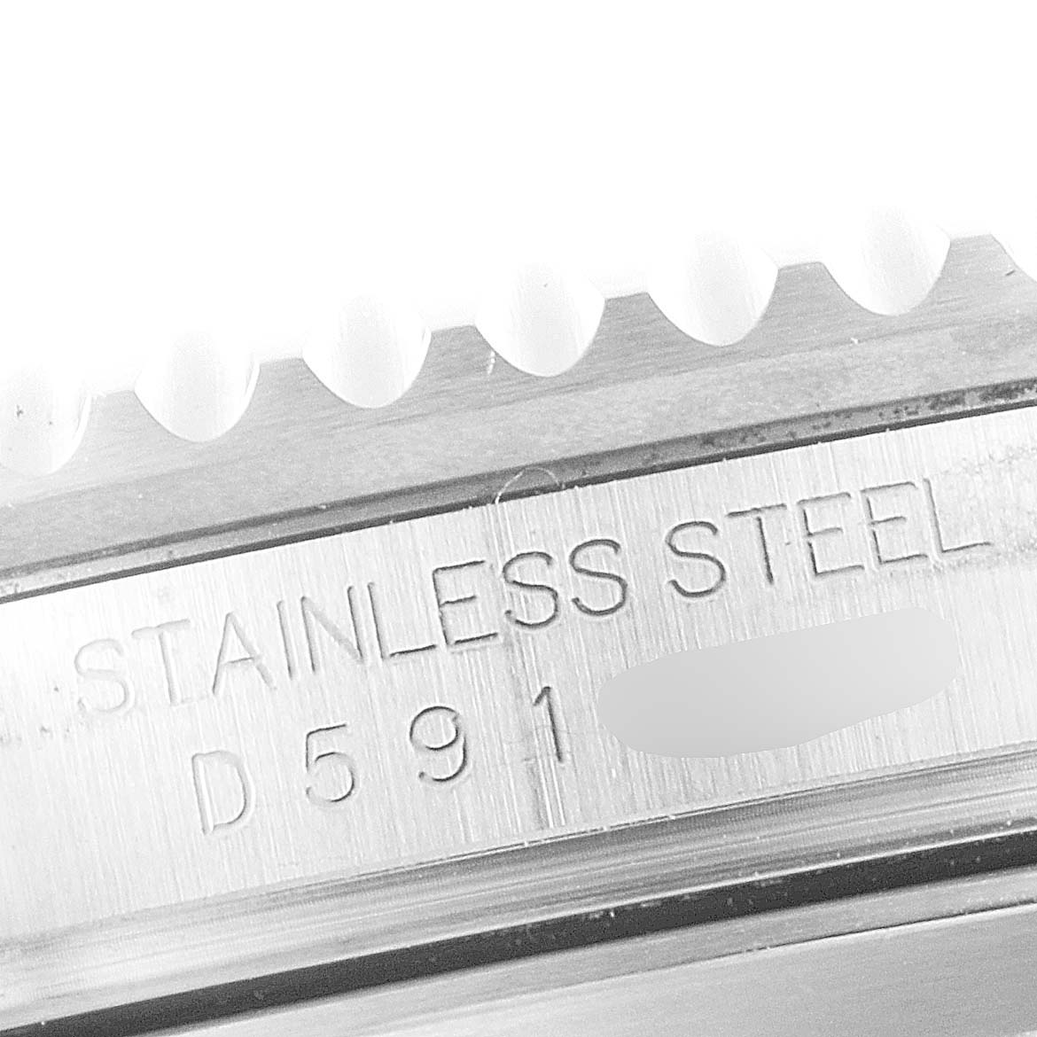 The image shows a close-up of the stainless steel bezel and part of the casing and serial number of a Rolex Submariner 16610 Men
s Stainless Steel Black Dial 16610 Men
s Stainless Steel Black Dial watch.