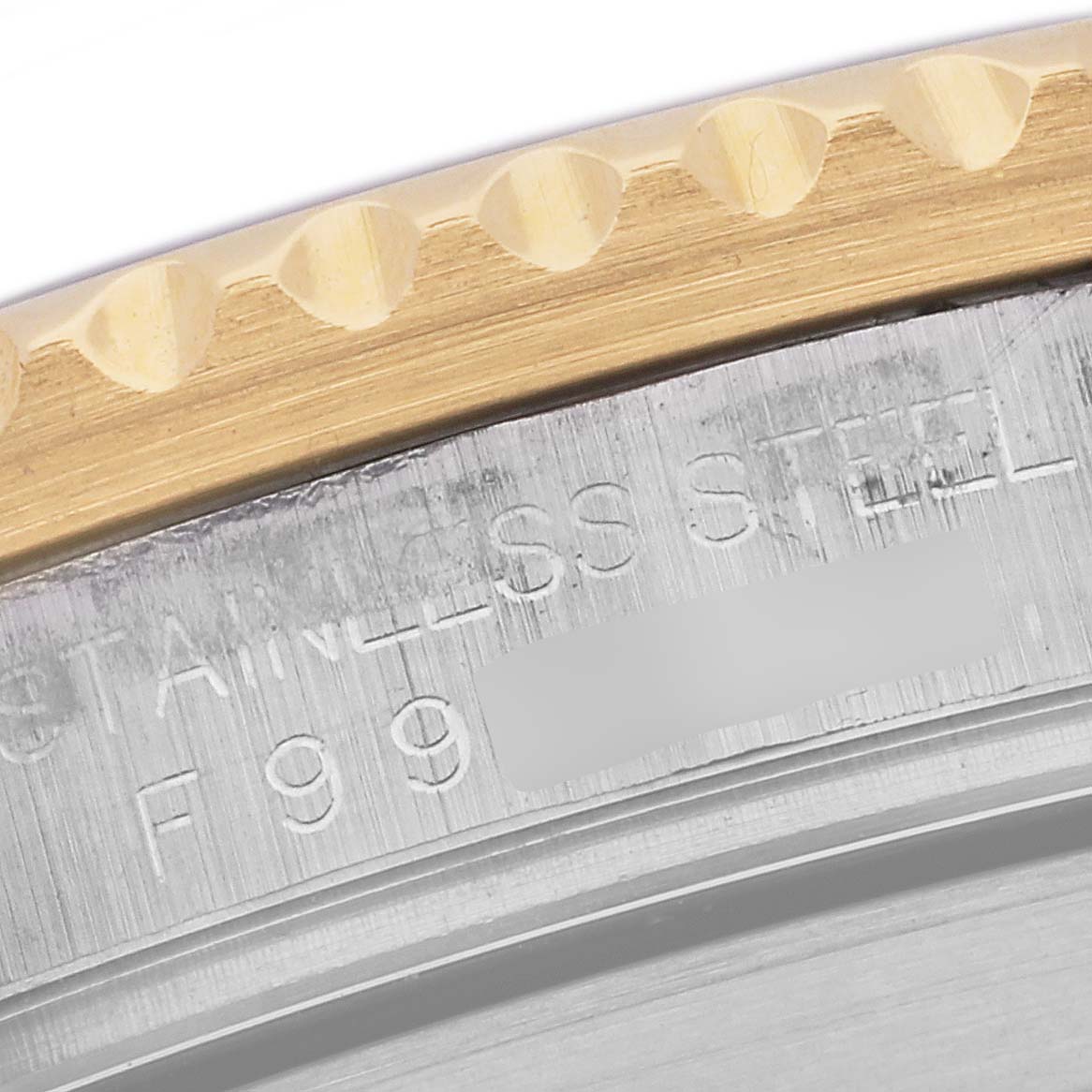 Close-up view of the Rolex Submariner 16613 Men's Steel and Gold (two tone) Blue Dial 16613 Men's Steel and Gold (two tone) Blue Dial, showing the stainless steel casing and the edge of the bezel with engraved markings.