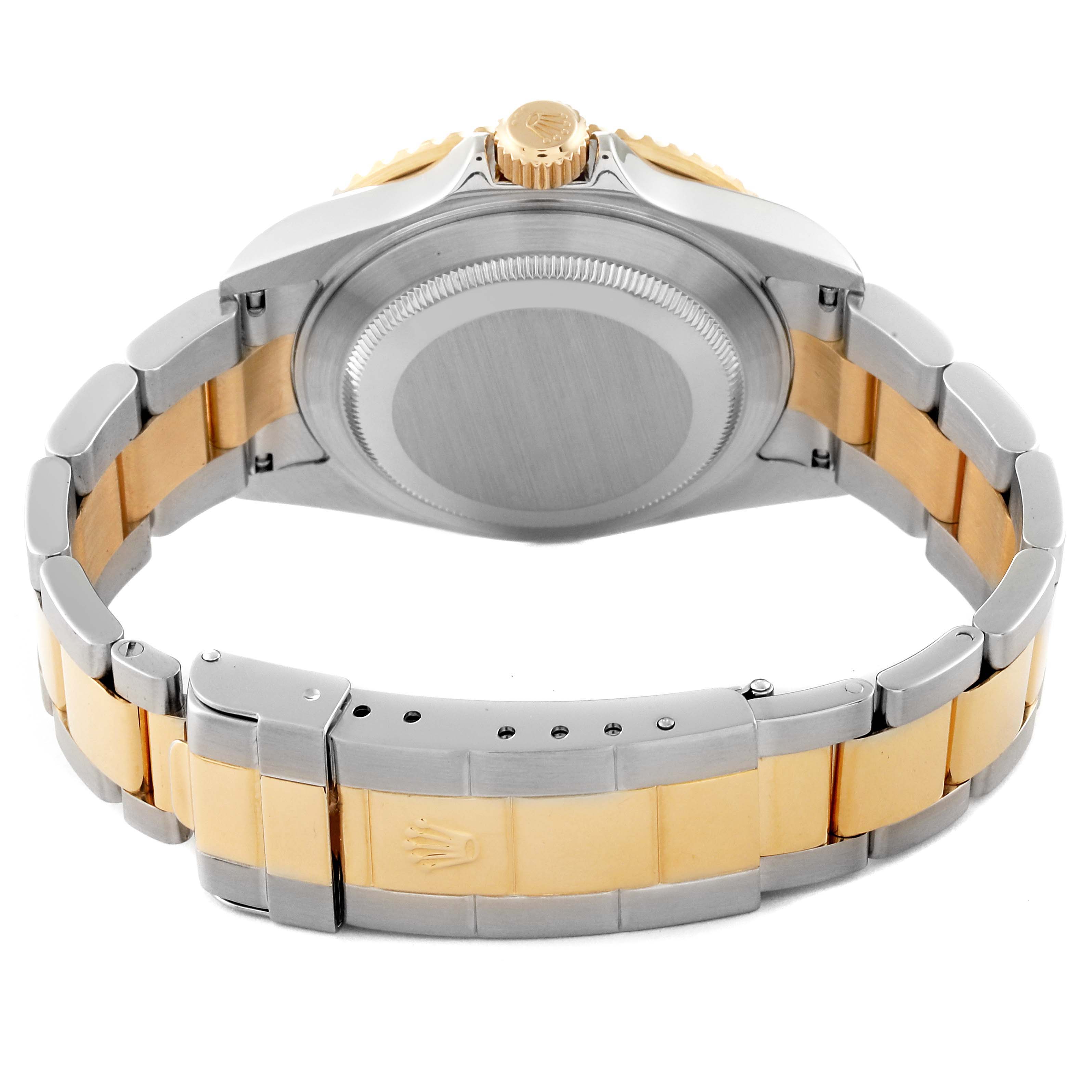 The image shows the backside of a Rolex Submariner 16613 Men's Steel and Gold (two tone) Blue Dial 16613 Men's Steel and Gold (two tone) Blue Dial watch, highlighting the bracelet, clasp, and case back.