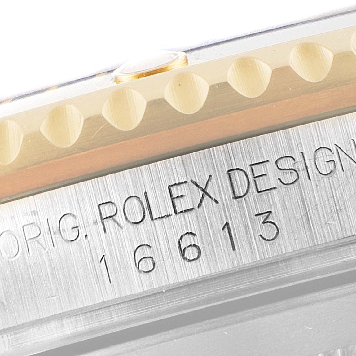 This close-up angle of the Rolex Submariner 16613 Men
s Steel and Gold (two tone) Blue Dial 16613 Men
s Steel and Gold (two tone) Blue Dial watch shows the bezel and engraved case with the model number 16613.