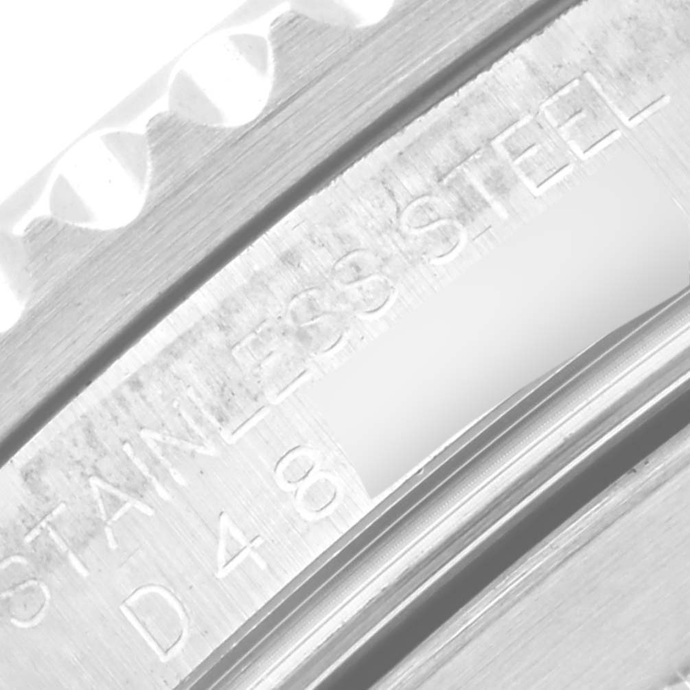 This image shows a close-up of a stainless steel marking on the case of a Rolex Submariner 16610 Men
s Stainless Steel Black Dial 16610 Men
s Stainless Steel Black Dial.