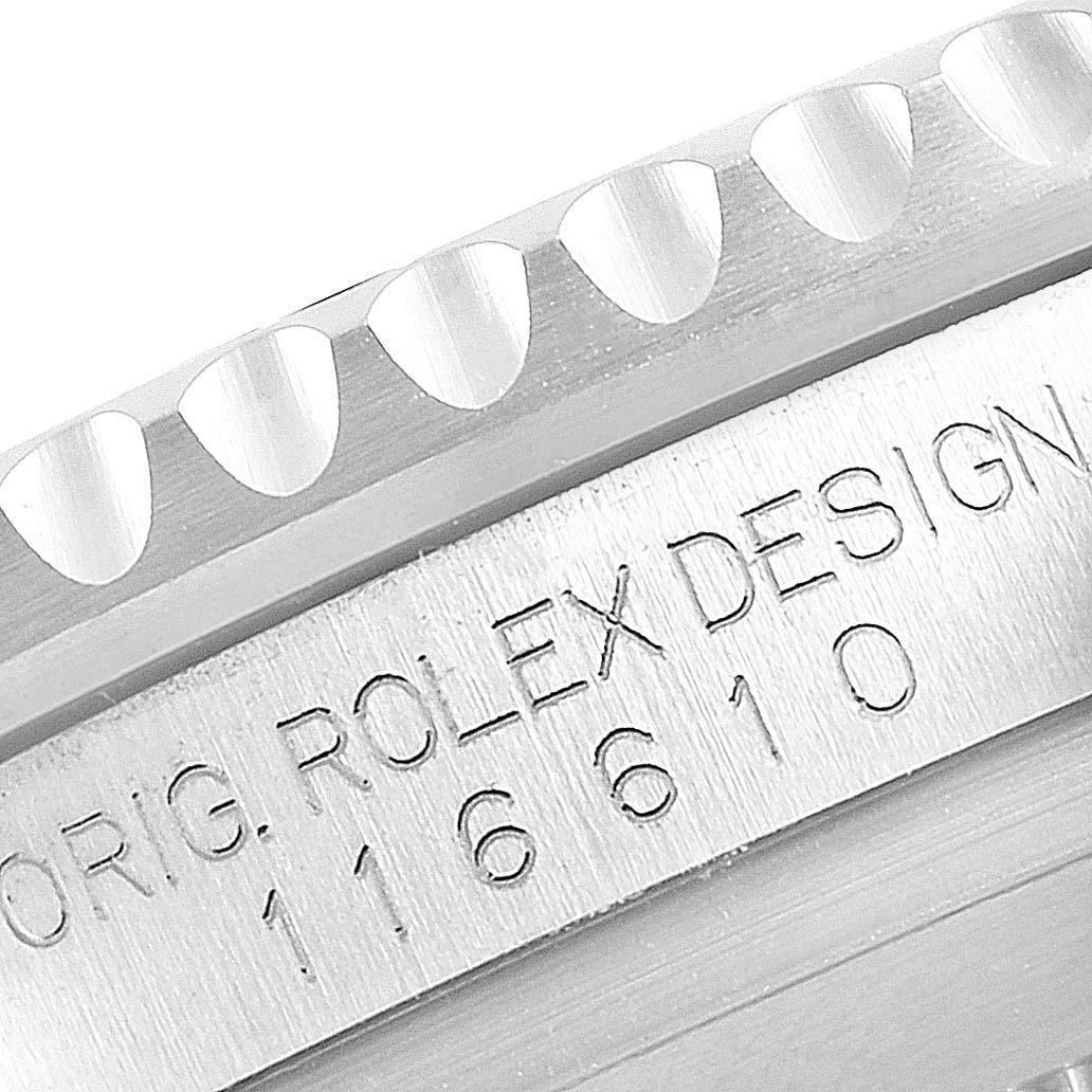 This image shows a close-up of the engraved sides of the bezel and the serial number on the case of a Rolex Submariner 116610LV Men
s Stainless Steel Green Dial 116610LV Men
s Stainless Steel Green Dial watch.