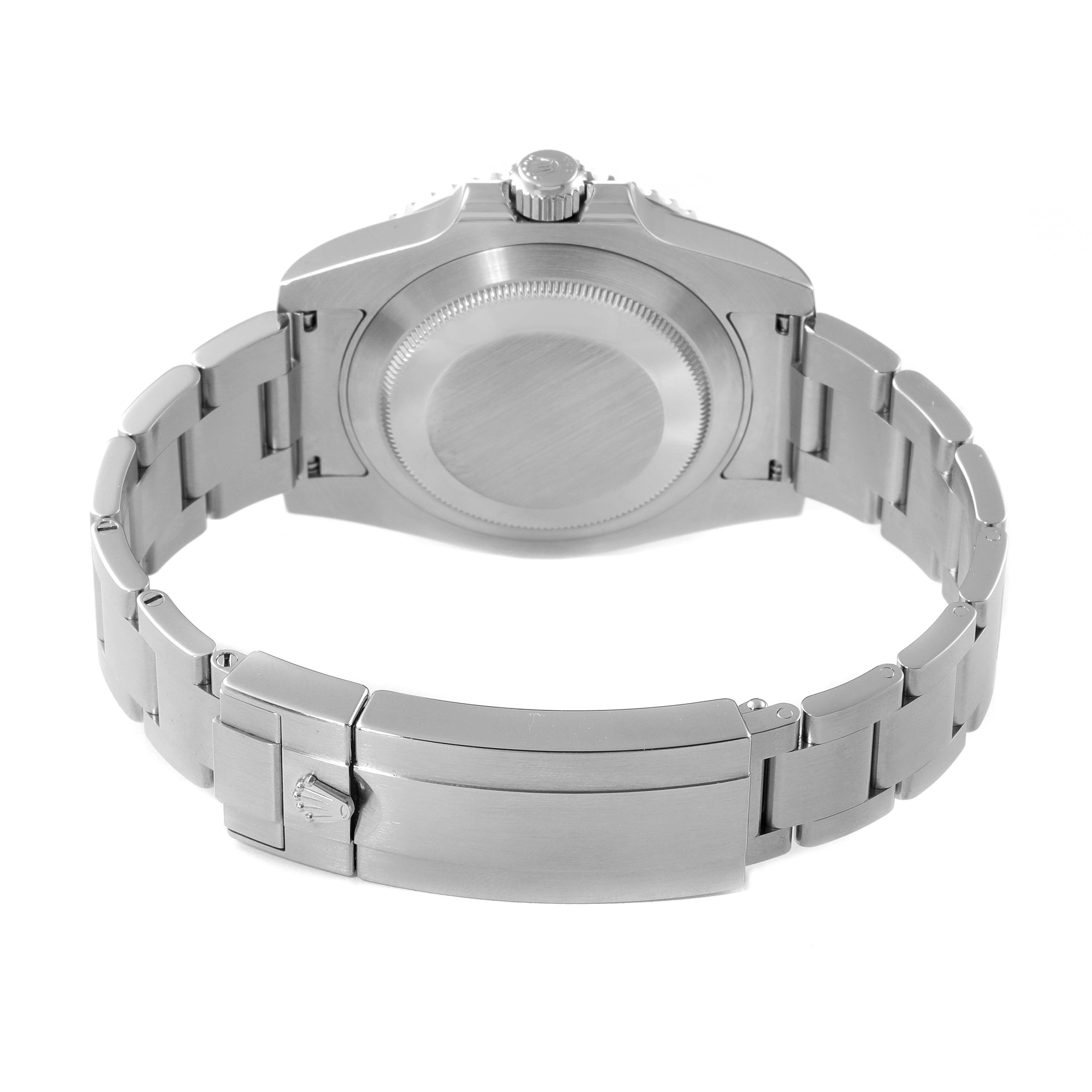 The image shows the back side of a Rolex Submariner 116610LV Men
s Stainless Steel Green Dial 116610LV Men
s Stainless Steel Green Dial watch, focusing on the closed case back and metal bracelet.