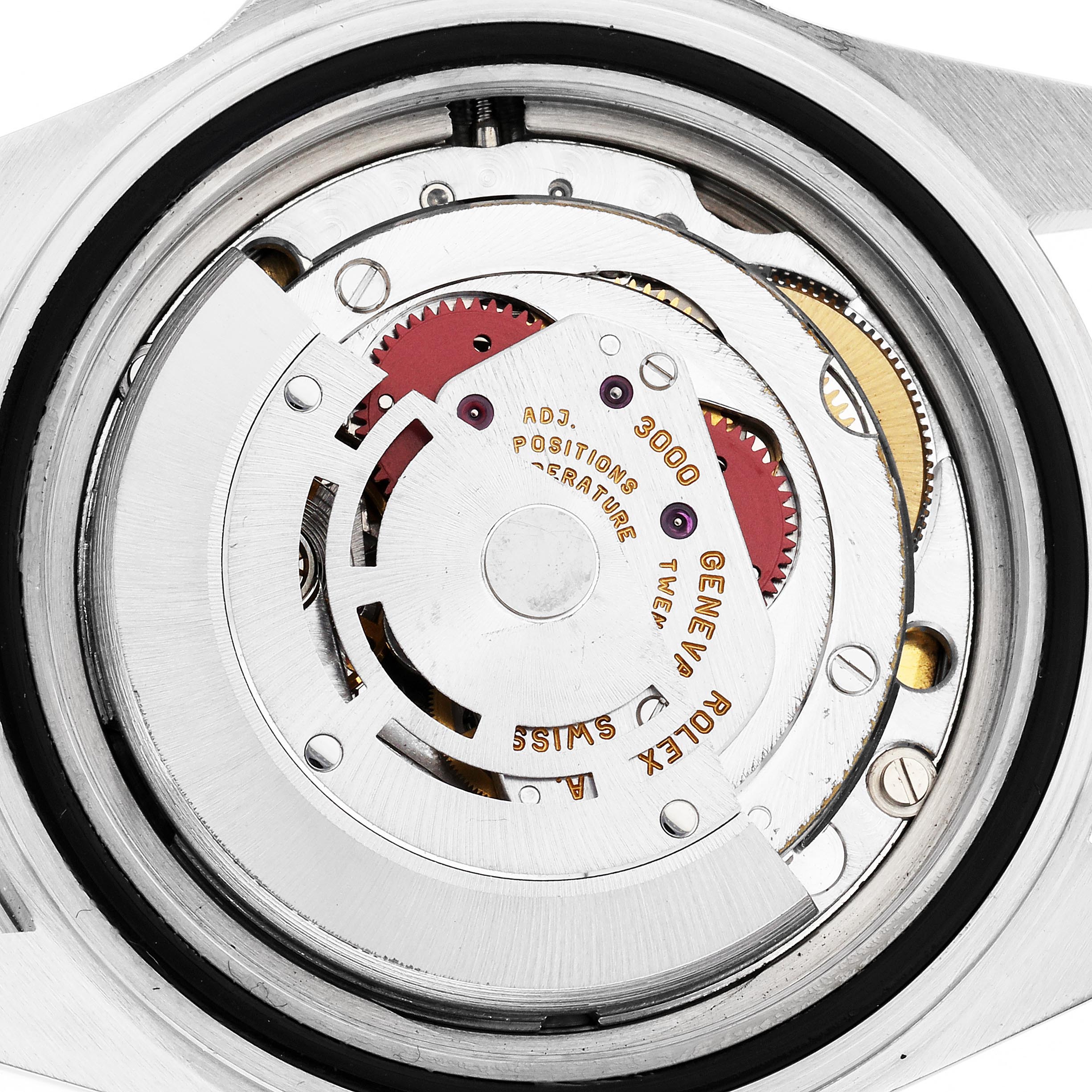 The image shows the inner movement of a Rolex Submariner 14060 Men's Stainless Steel Black Dial 14060 Men's Stainless Steel Black Dial watch viewed from the back, highlighting gears and the rotor.