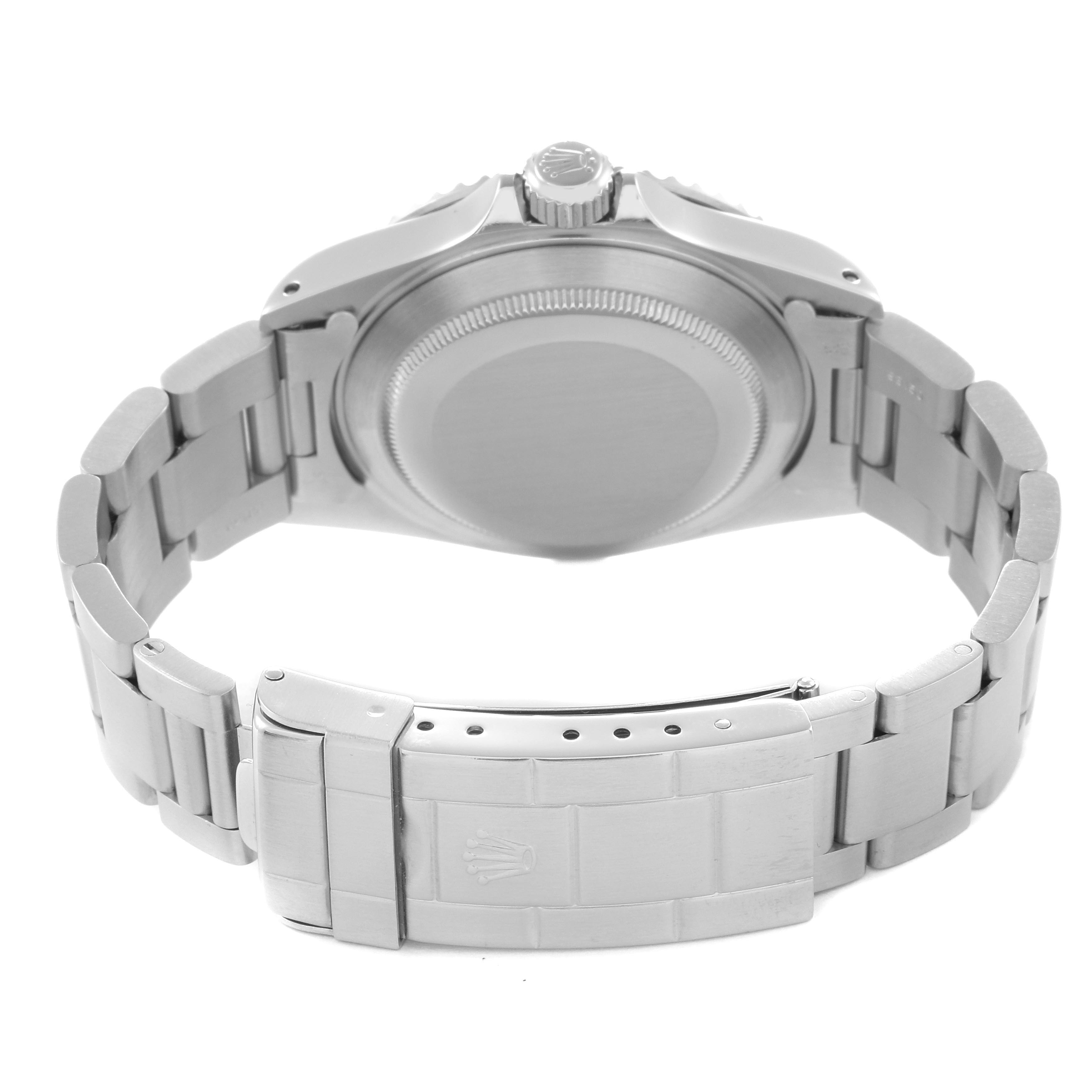 The image shows the back of the Rolex Submariner 14060 Men's Stainless Steel Black Dial 14060 Men's Stainless Steel Black Dial watch, including the case back and the bracelet with its clasp.