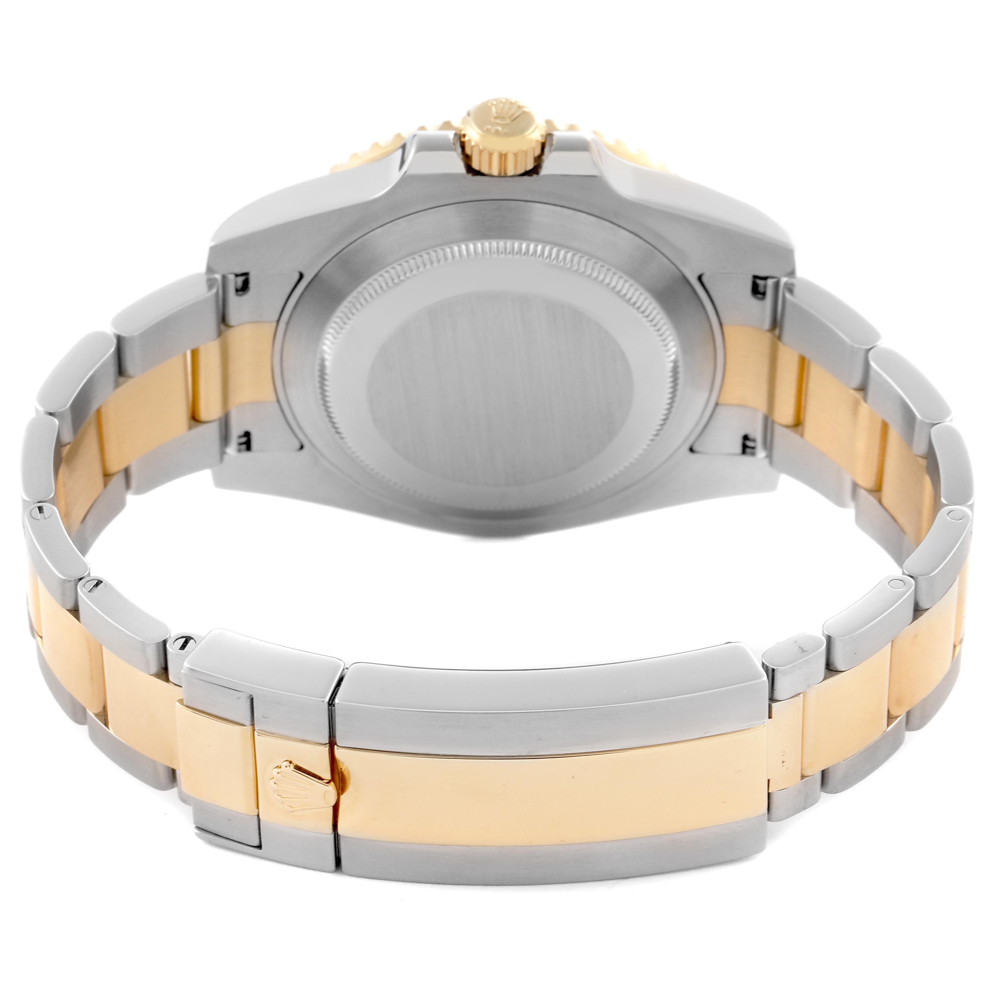 The image shows the back view of the Rolex Submariner 116613 Men's Steel and Gold (two tone) Black Dial 116613 Men's Steel and Gold (two tone) Black Dial, highlighting the case back and two-tone bracelet.