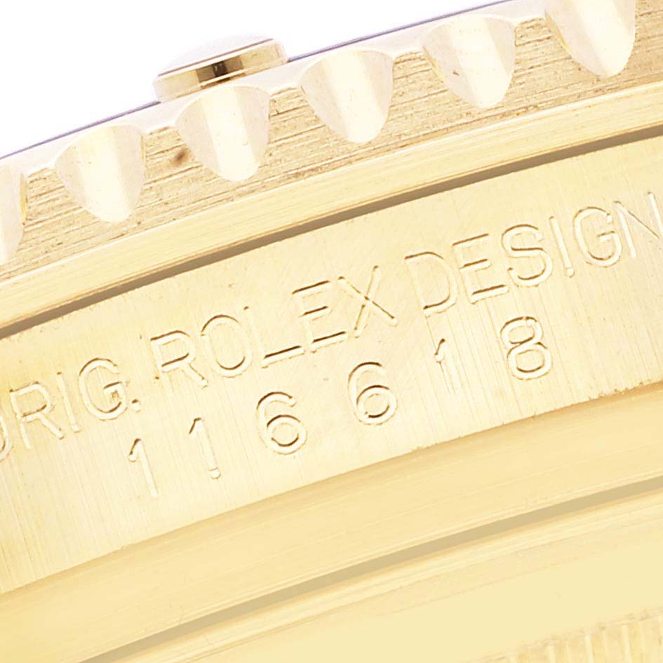 The image shows a close-up view of the engraved side of the case of a Rolex Submariner 116618 Men's Yellow Gold Blue Dial 116618 Men's Yellow Gold Blue Dial watch.