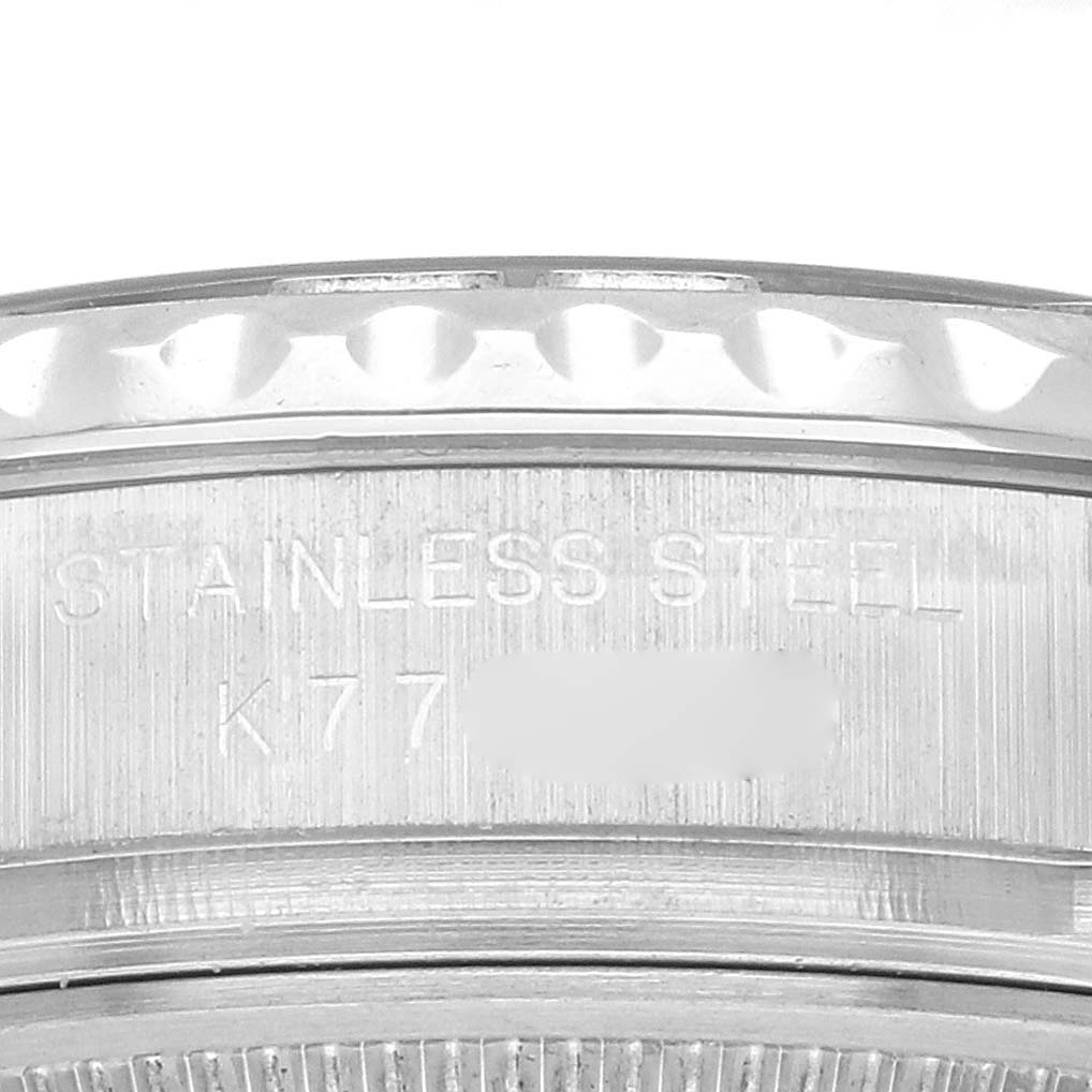 The image shows a close-up view of a Rolex Yacht-Master 169622 Women's Stainless Steel Silver Dial 169622 Women's Stainless Steel Silver Dial's stainless steel case side with engraved text.