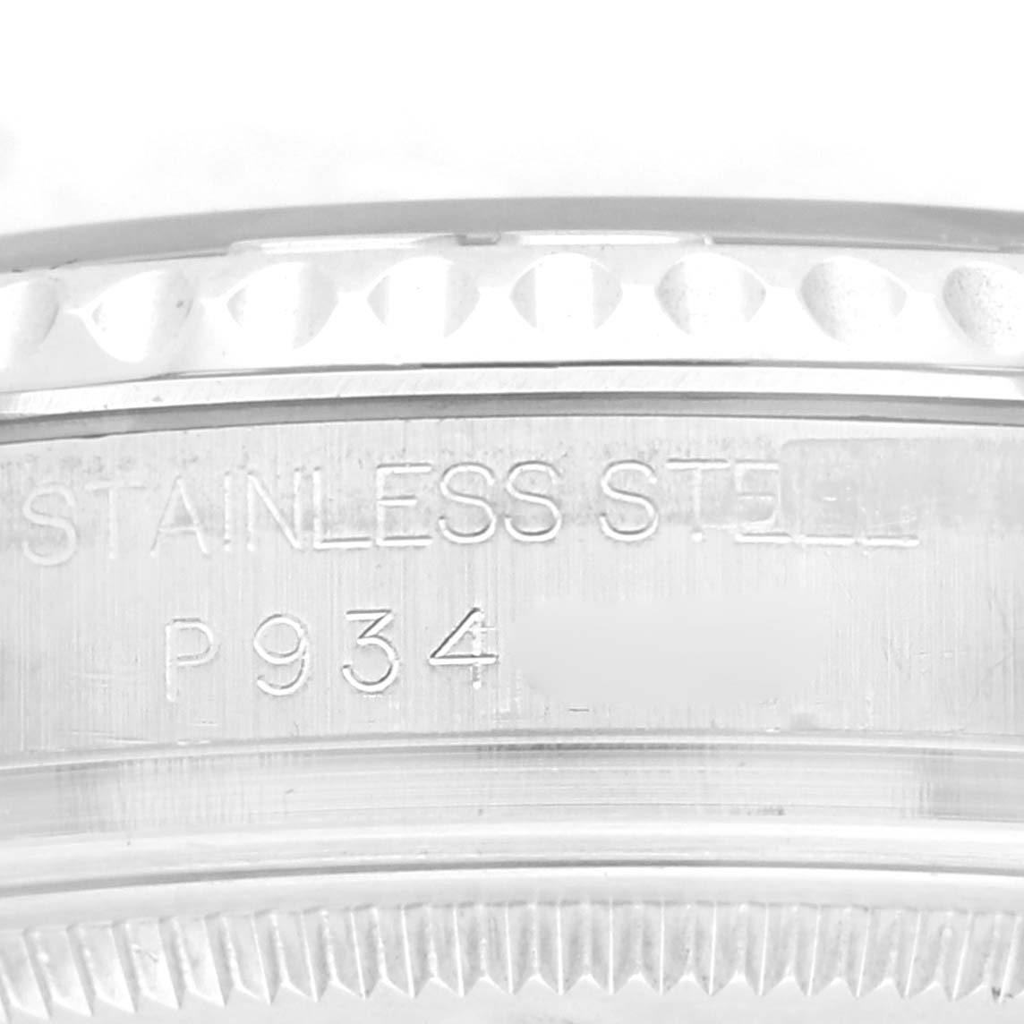 The image shows a close-up of the side engraving on a Rolex Yacht-Master 168622 Men's Stainless Steel Silver Dial 168622 Men's Stainless Steel Silver Dial watch, highlighting "STAINLESS STEEL" and a serial number.