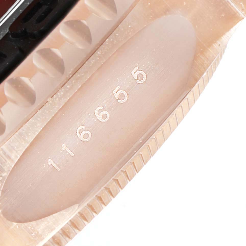 This image shows the engraved serial number on the side of a Rolex Yacht-Master 116655  Men's Rose Gold Black Dial 116655  Men's Rose Gold Black Dial watch case.